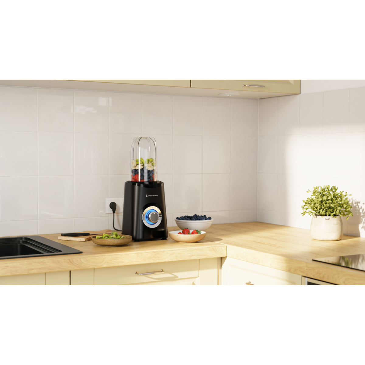 Black blender with fruit in cup on kitchen counter with blueberries and strawberries.