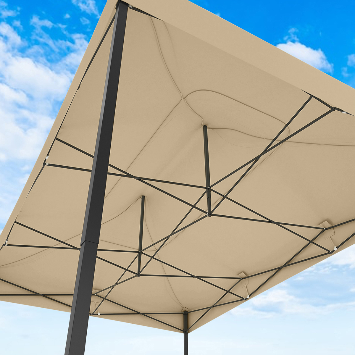 Underside of a tan canopy with black metal frame against a blue sky.