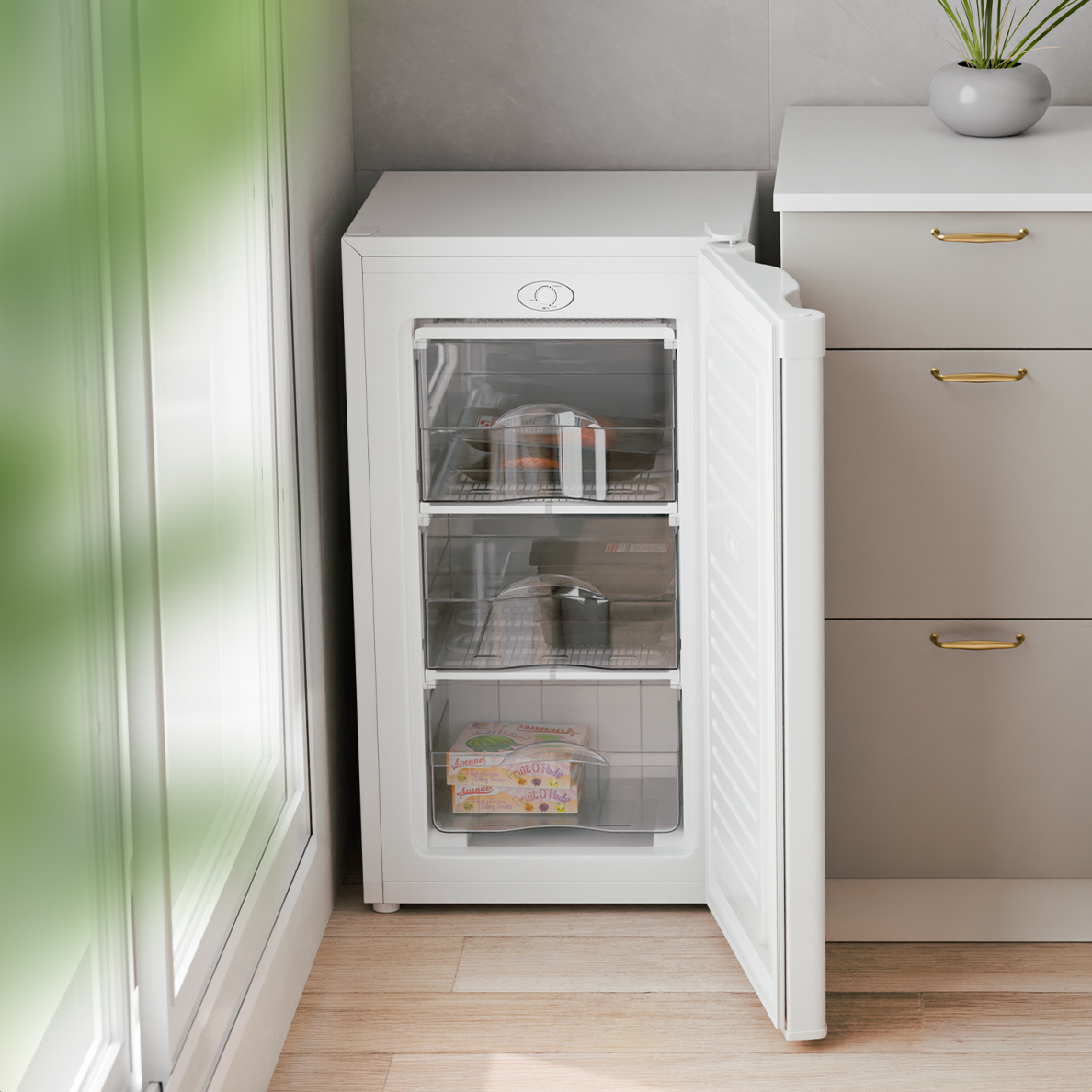 A white upright freezer with its door open, showing three drawers with food items.