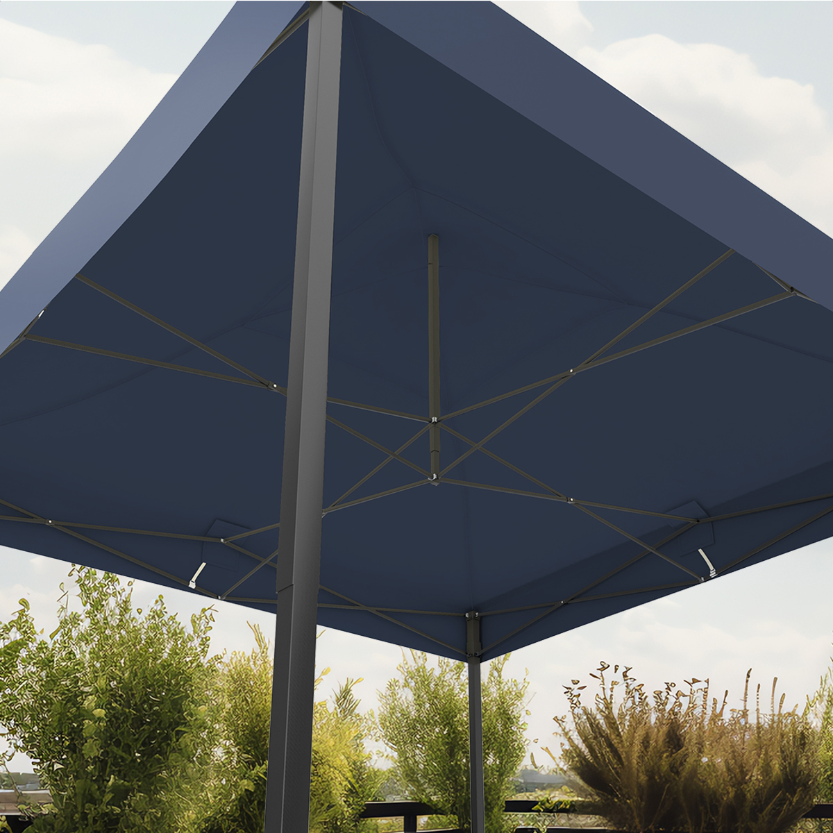 Dark blue awning with metal frame, green trees and sky in background.