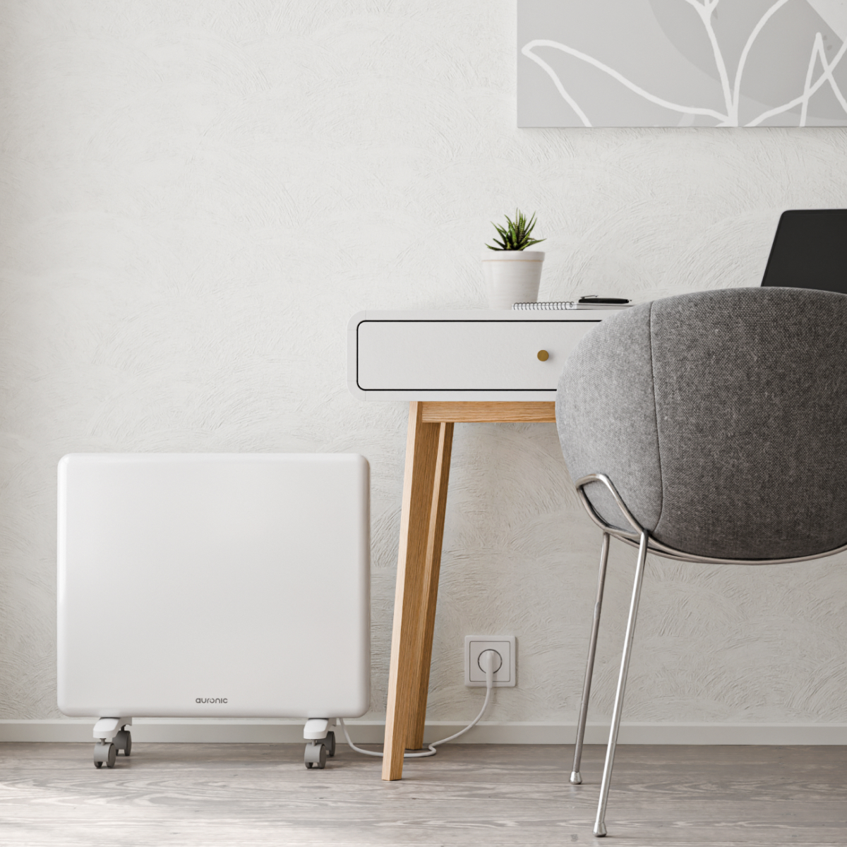 Un radiateur blanc portable se trouve sur un parquet à côté d'un bureau blanc avec une chaise grise.