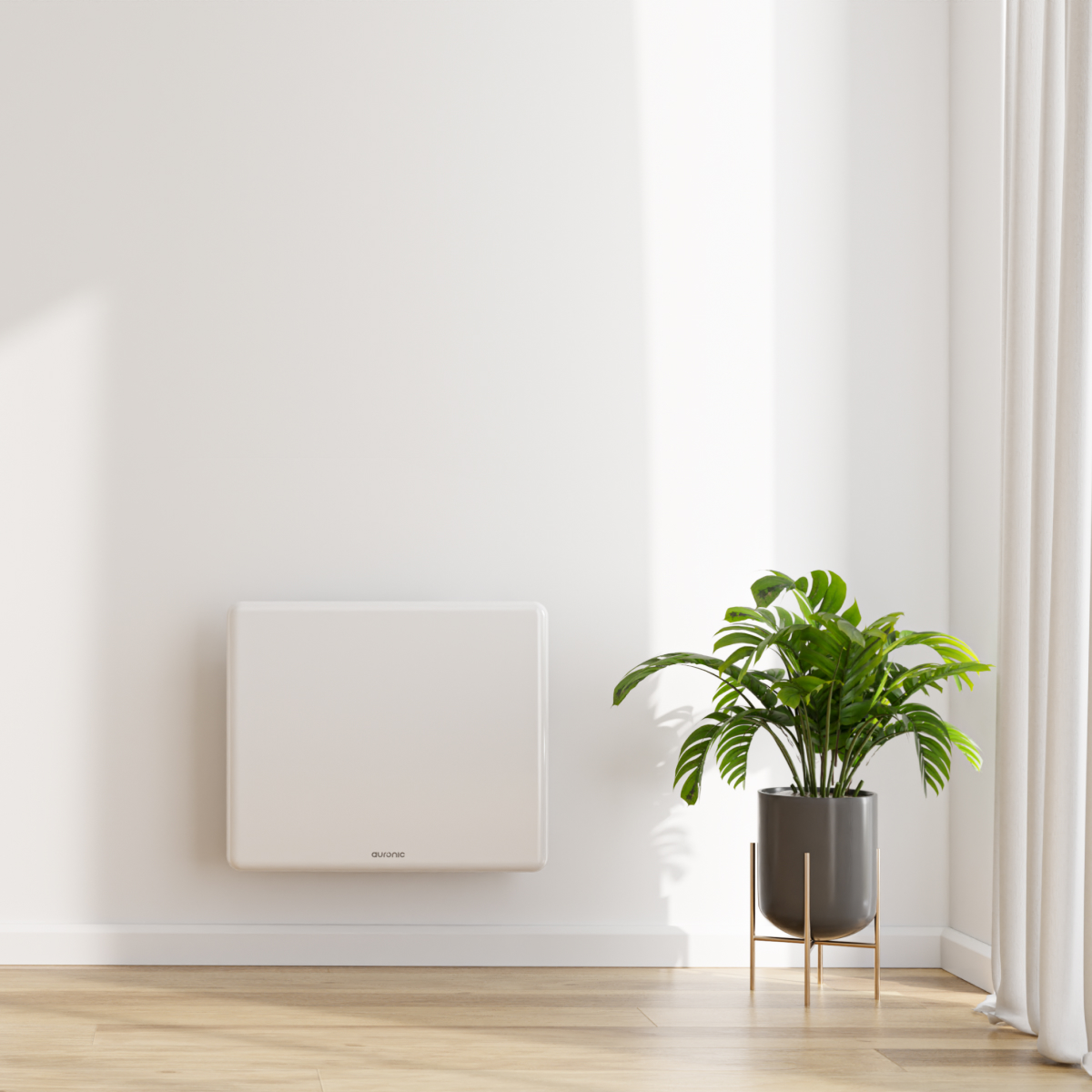 Un radiateur blanc est accroché à un mur blanc à côté d'une plante en pot.