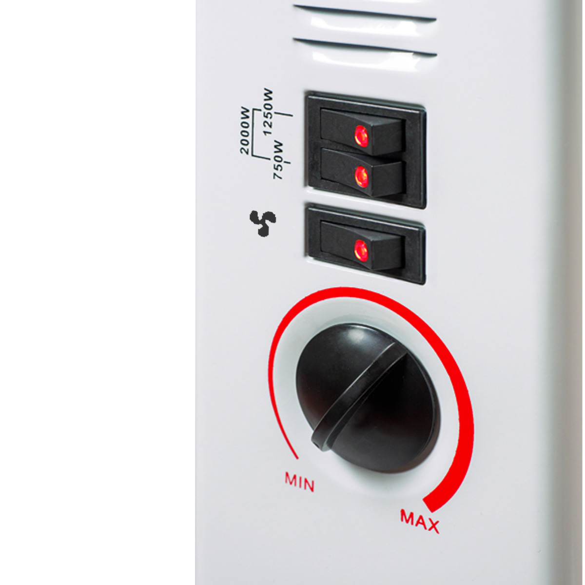 Close-up of a white heater's control panel with switches, fan icon, and a dial.