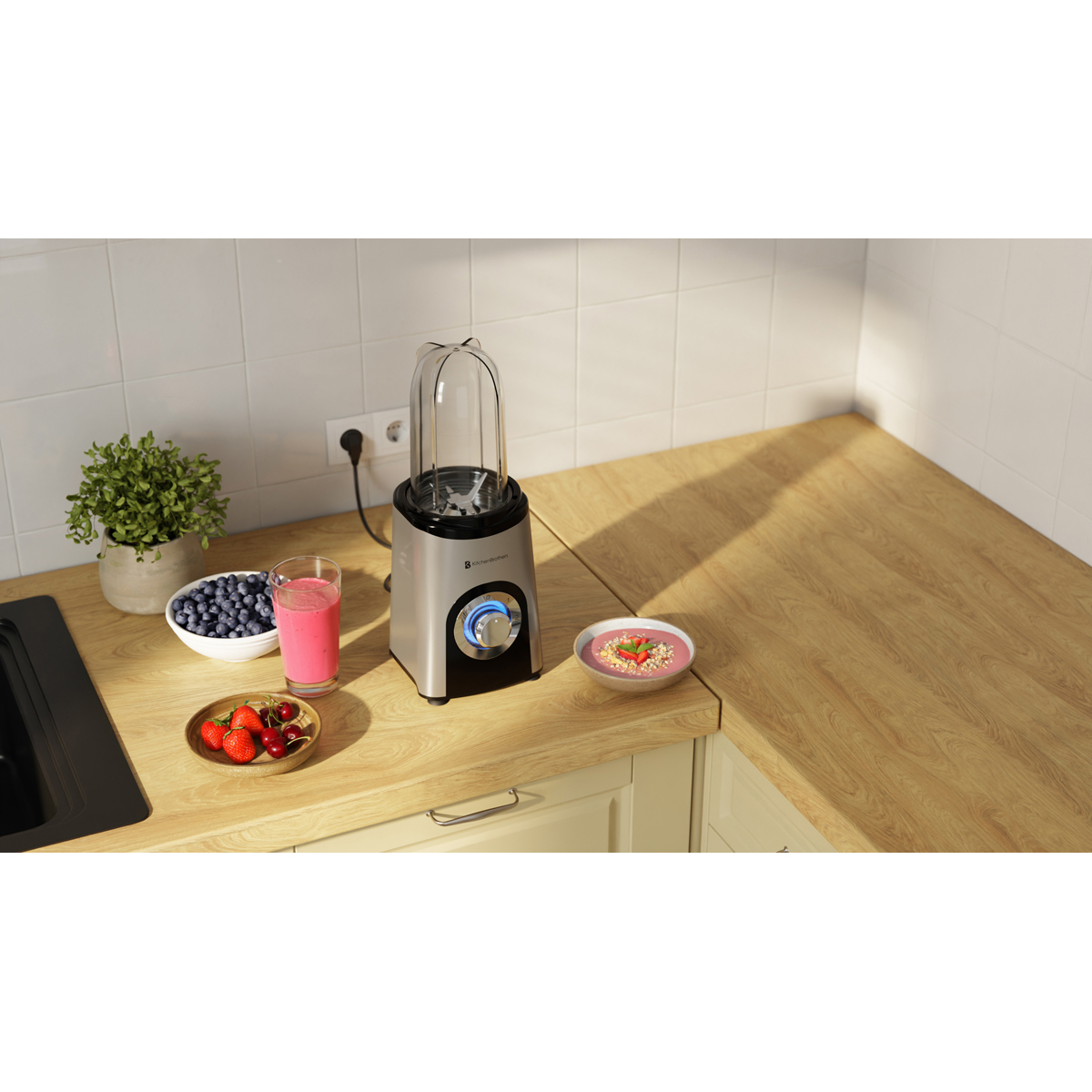 Silver blender with glass jar, berries, strawberries, and smoothie on a wooden counter.