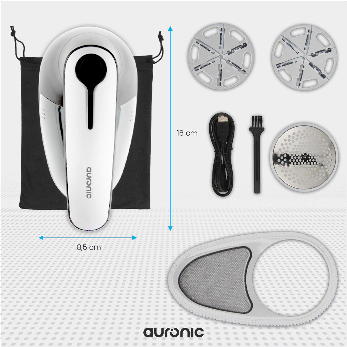 Een witte pluizenverwijderaar met accessoires, inclusief zak, kabel en borstel.