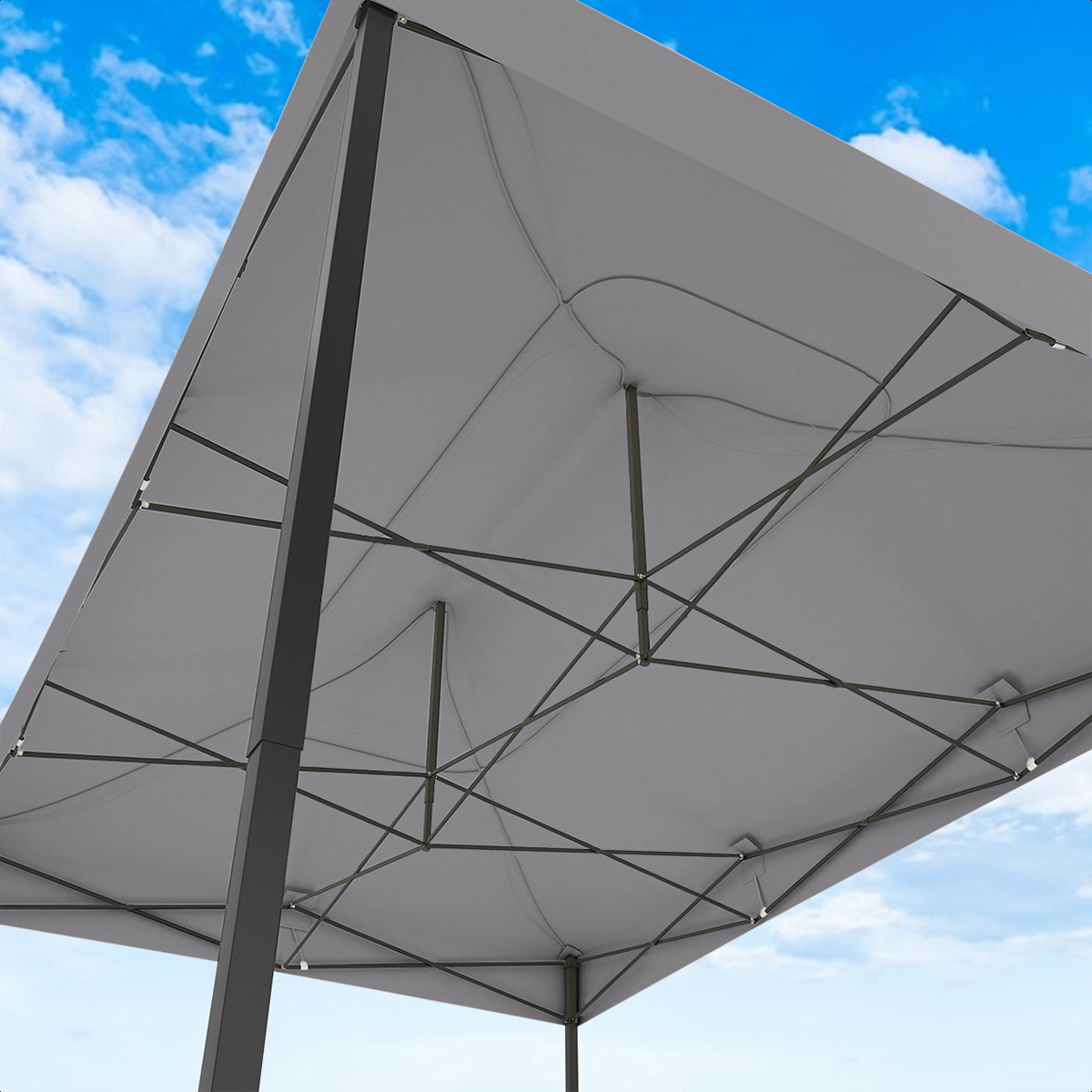 Underside of a grey canopy tent with metal frame against a blue sky.