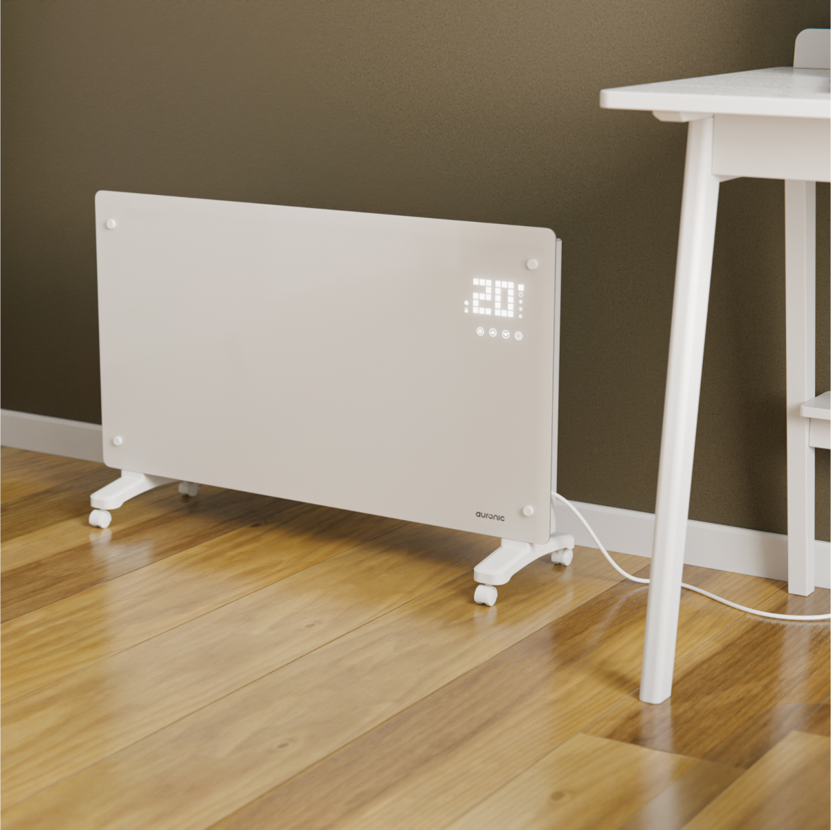 A white radiator with wheels and a digital display sits on a wooden floor next to a white table.