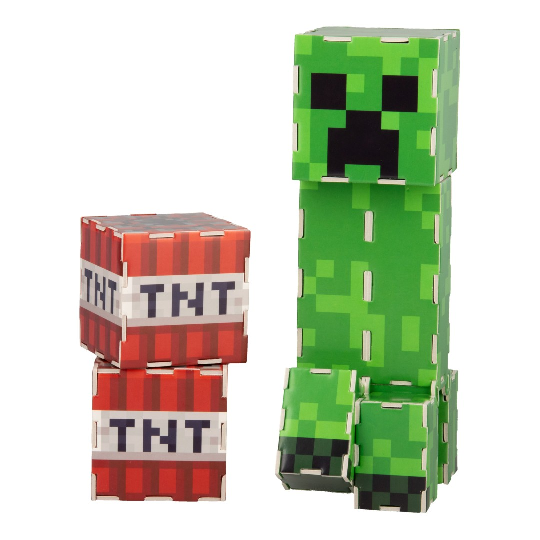Ein grüner Minecraft Creeper steht neben zwei roten TNT-Blöcken.