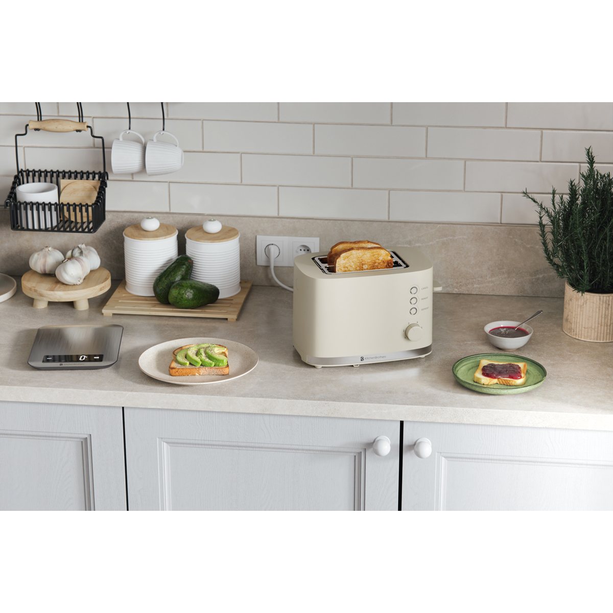 A cream toaster with toast, avocado toast, and jam toast on a kitchen counter.