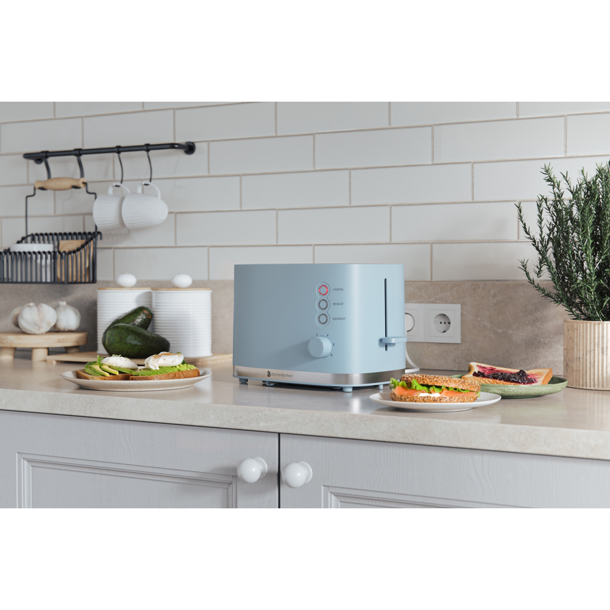A blue toaster sits on a kitchen counter with sandwiches and avocado toast.