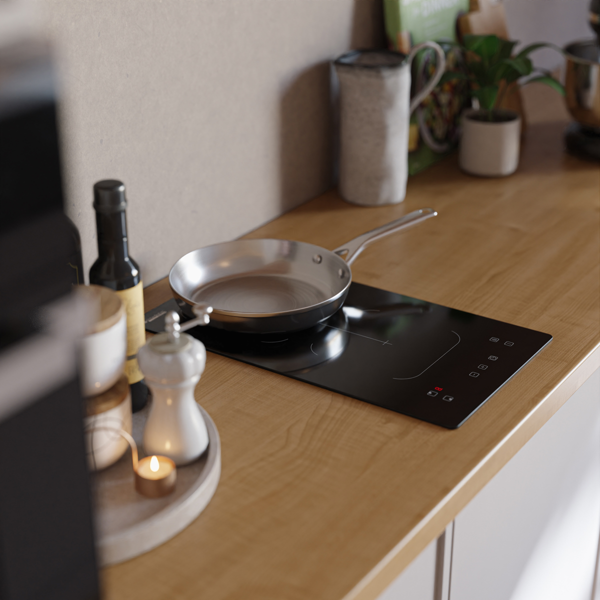 Een koekenpan op een inductiekookplaat in een keuken.