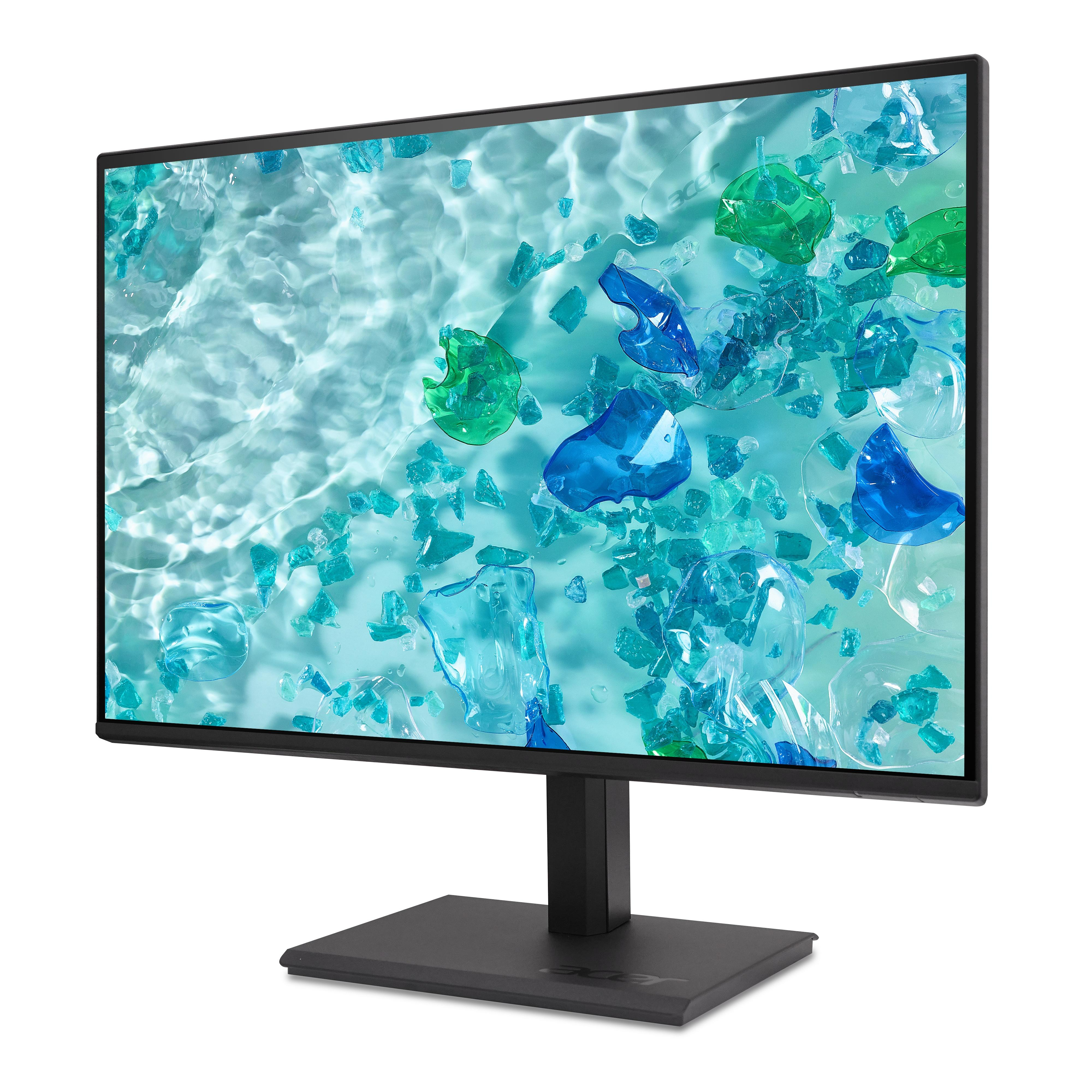 Ein Monitor zeigt ein abstraktes Bild von blauen und grünen Kristallen im Wasser.