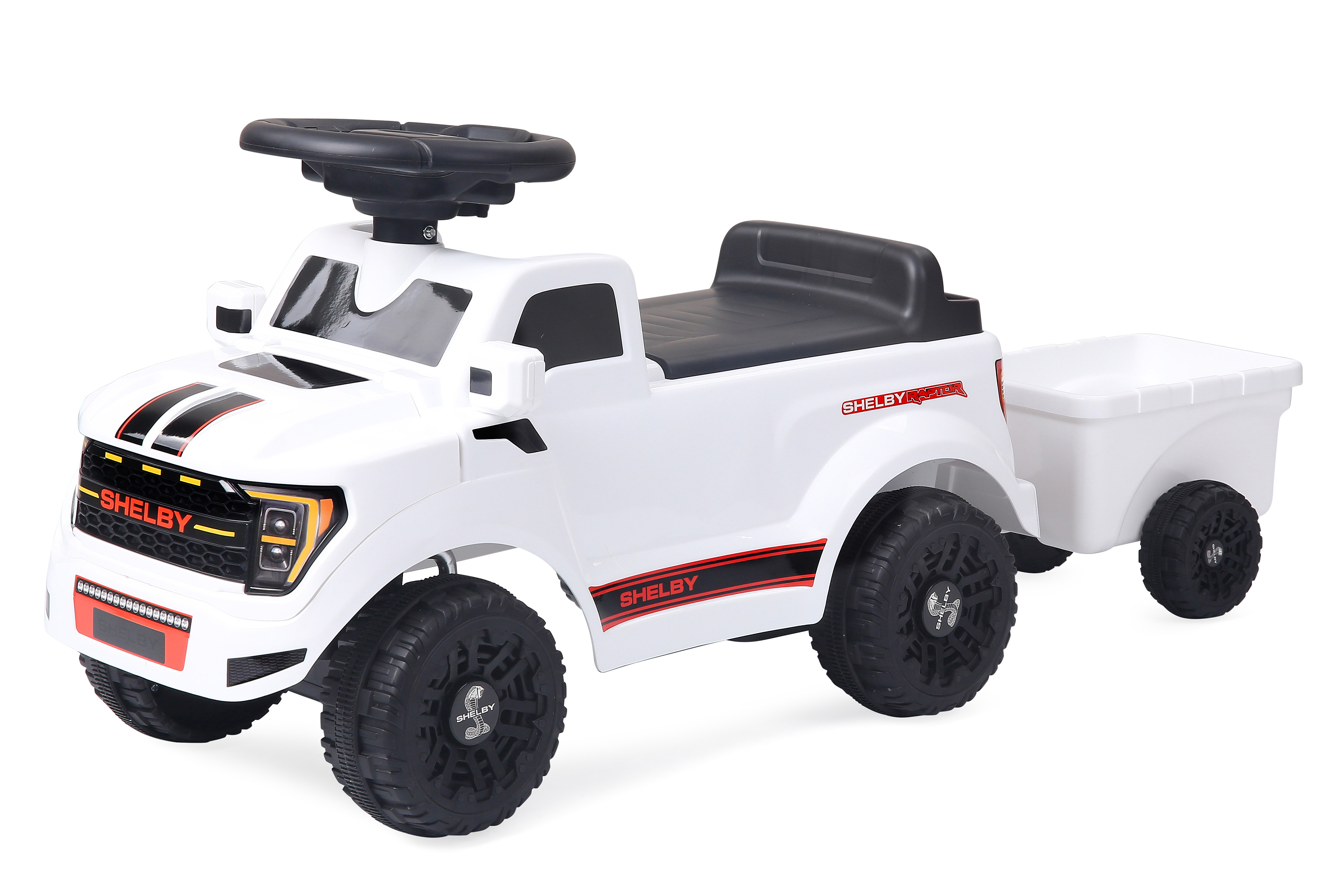 Ein weißes Kinderfahrzeug im Stil eines Shelby-Pickups mit Anhänger.