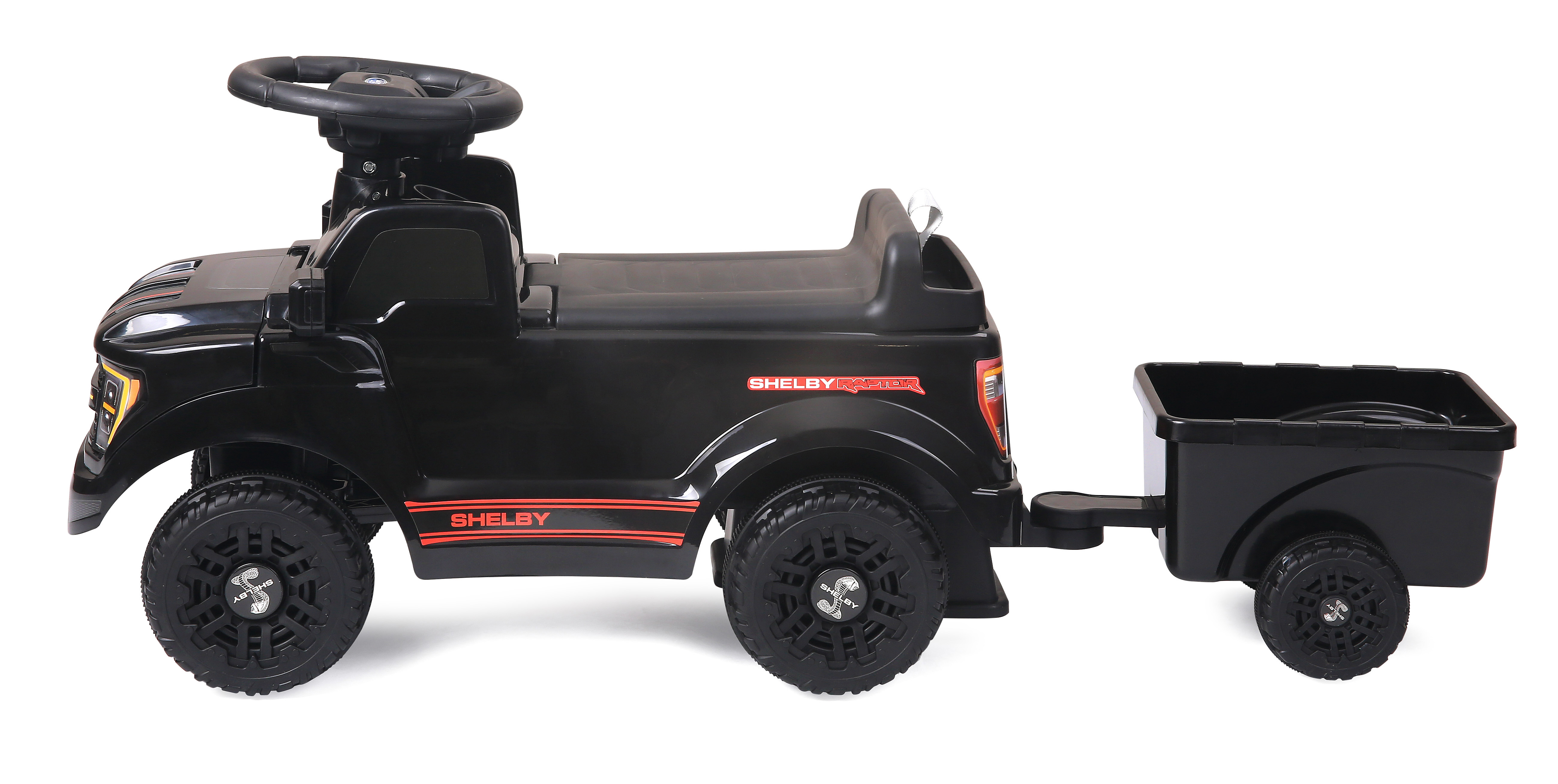 Schwarzes Spielzeugauto mit Anhänger, Shelby Raptor Aufkleber.