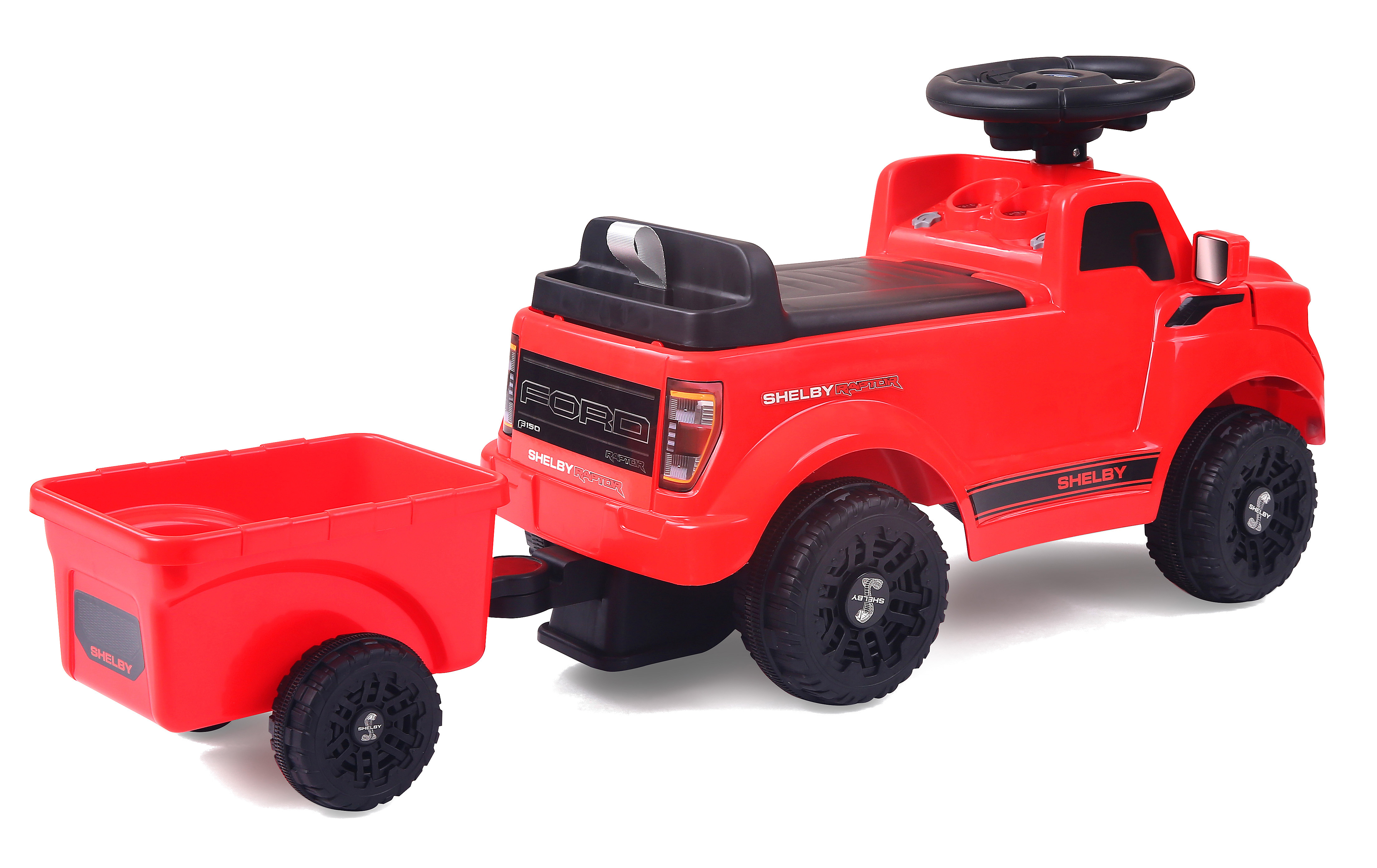 Un camioncino giocattolo rosso con rimorchio, simile a un Ford F-150 Raptor.
