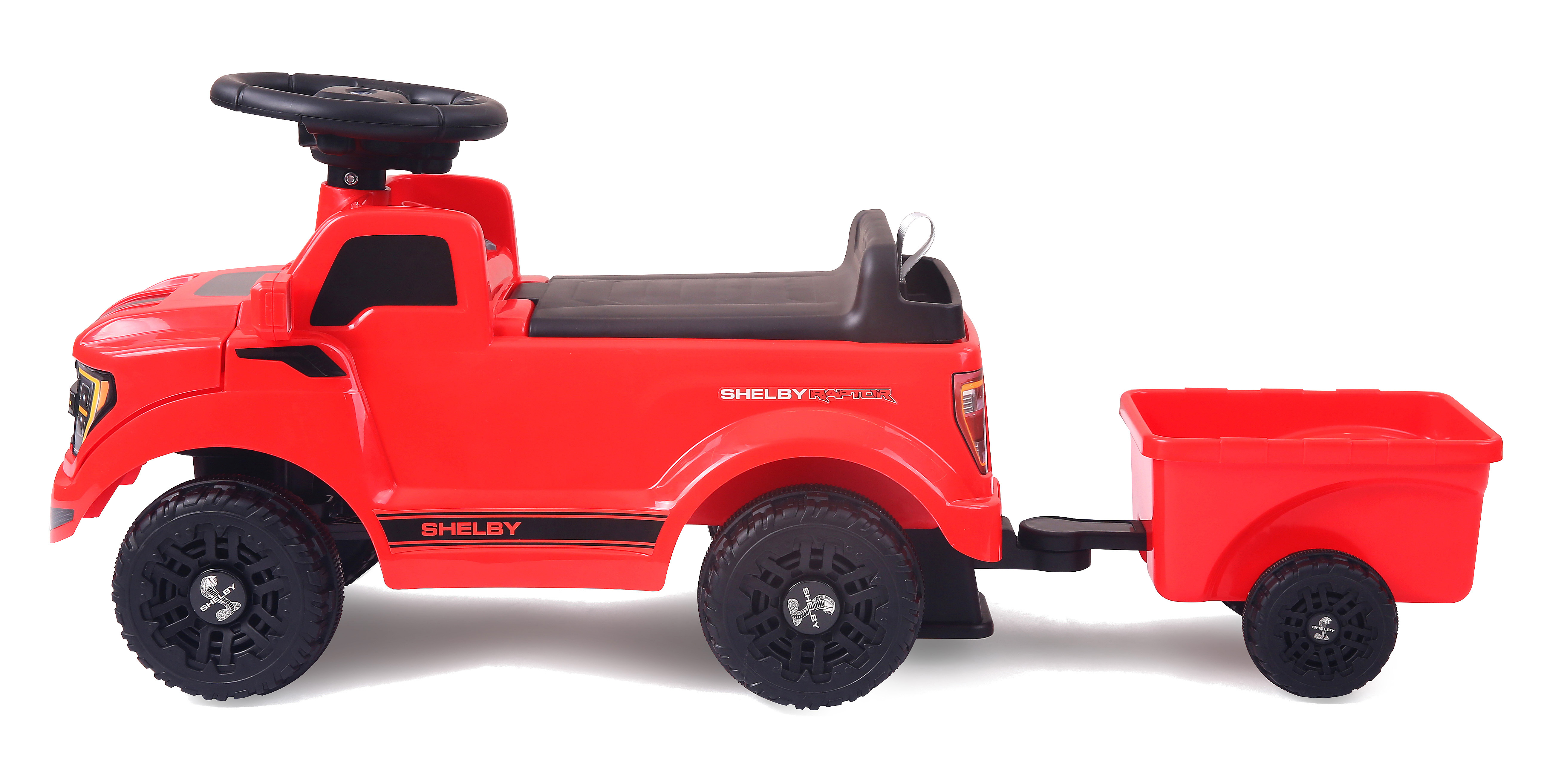 Pick-up giocattolo rosso con rimorchio e volante nero su sfondo bianco.