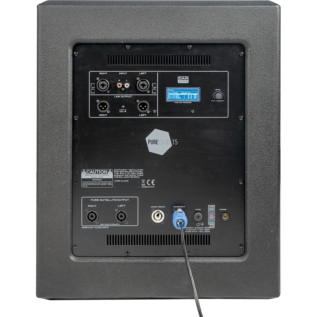 Rear view of a black speaker with connections, display, and warning labels.