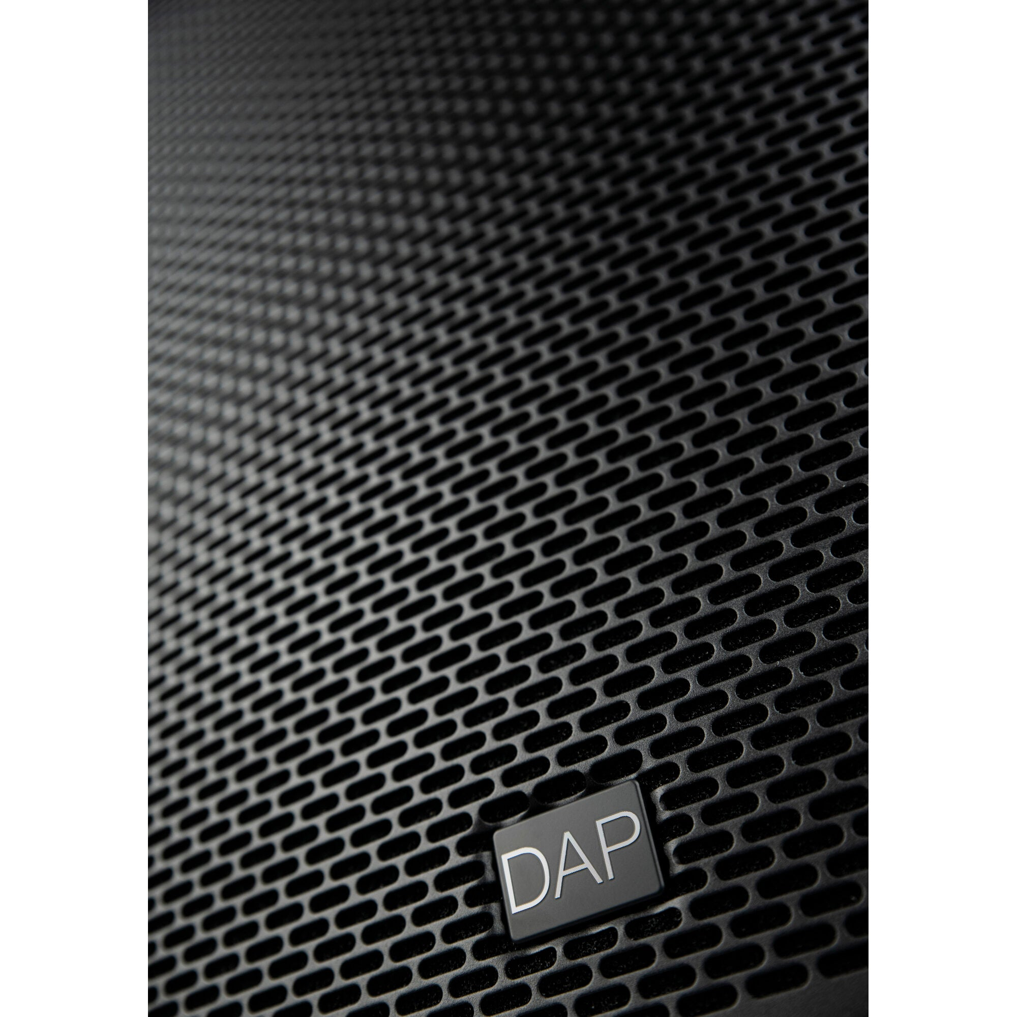 Close up of a black speaker grille with a silver DAP logo.
