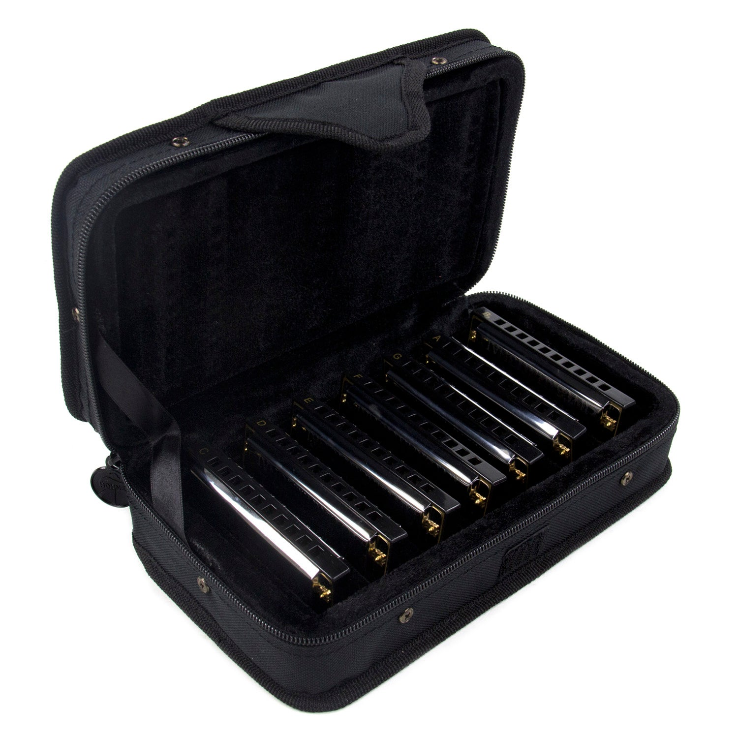 A black zippered case holding multiple harmonicas, arranged in compartments.