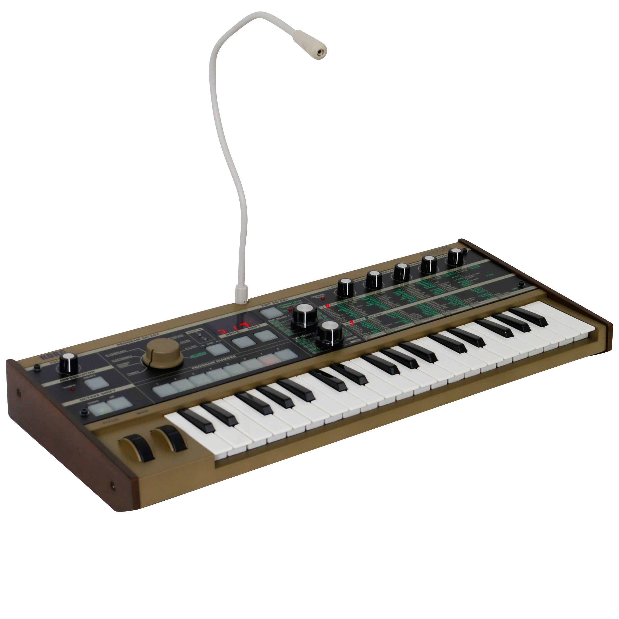 A gold synthesizer with white and black keys, knobs, and a microphone.