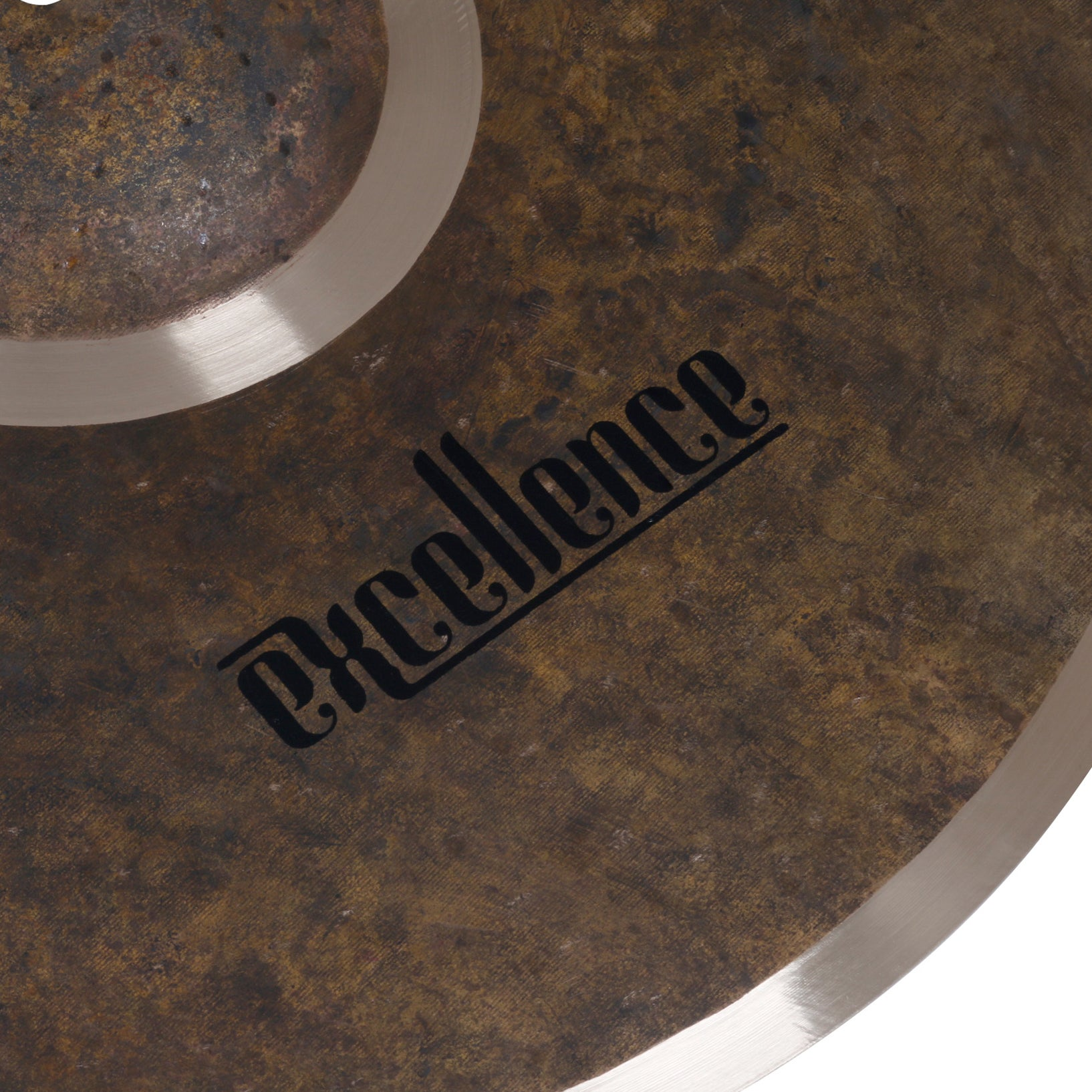 A bronze cymbal with the word "Excellence" in black script.