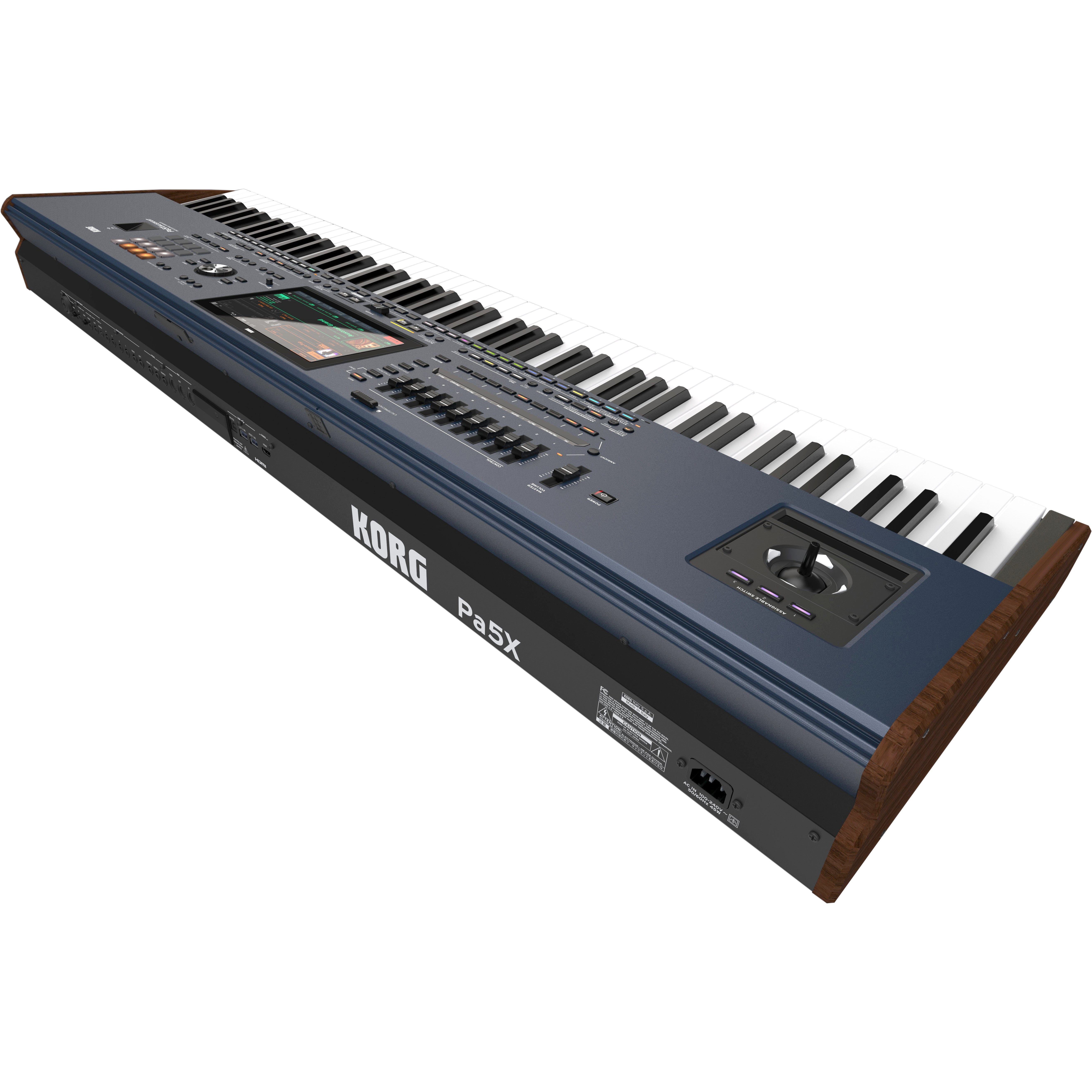 A blue Korg Pa5X keyboard with wood accents, keys, and a touchscreen display.