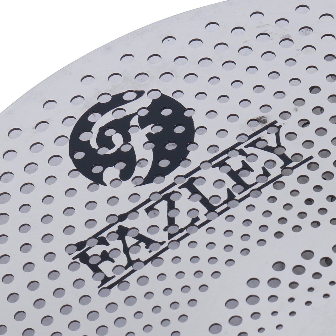 Close-up of a silver metal sheet with many small holes and the black FAZLEY logo.
