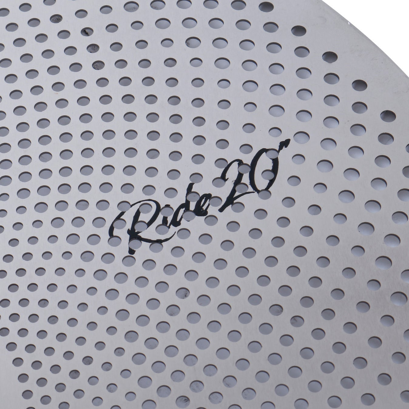 A silver cymbal with many small holes and the inscription "Ride 20".