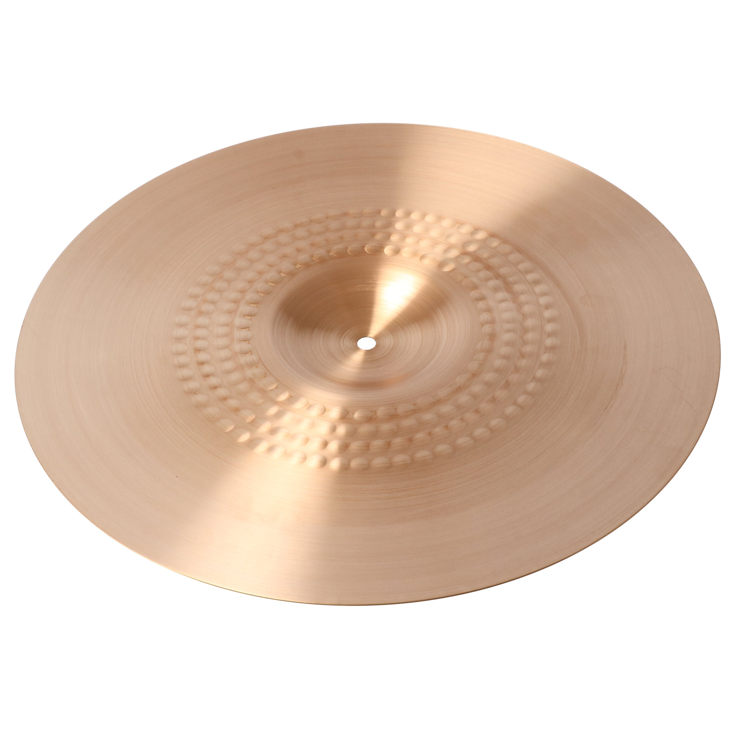 A bronze cymbal with concentric circles of small indentations.