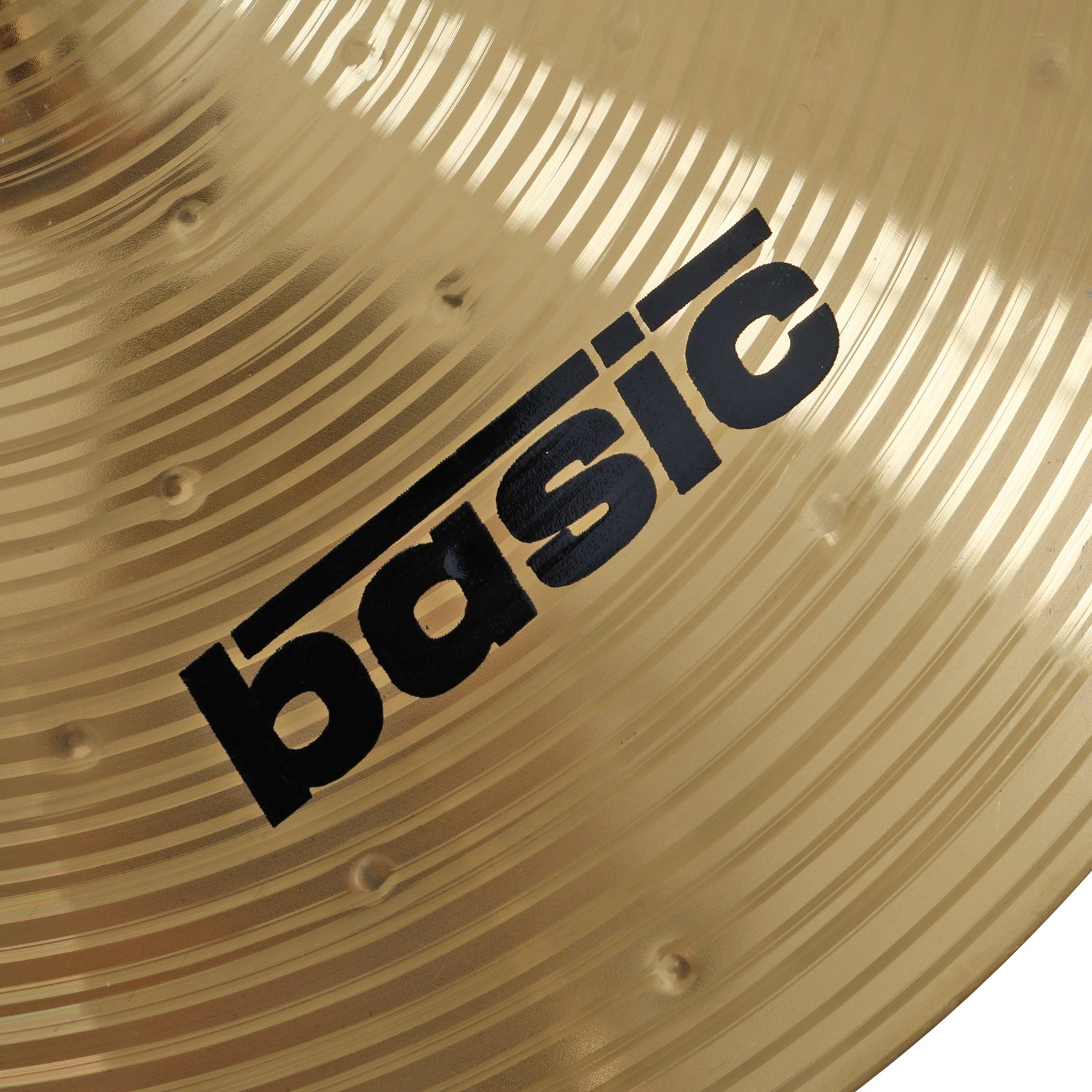A golden cymbal with black "basic" lettering and concentric grooves.