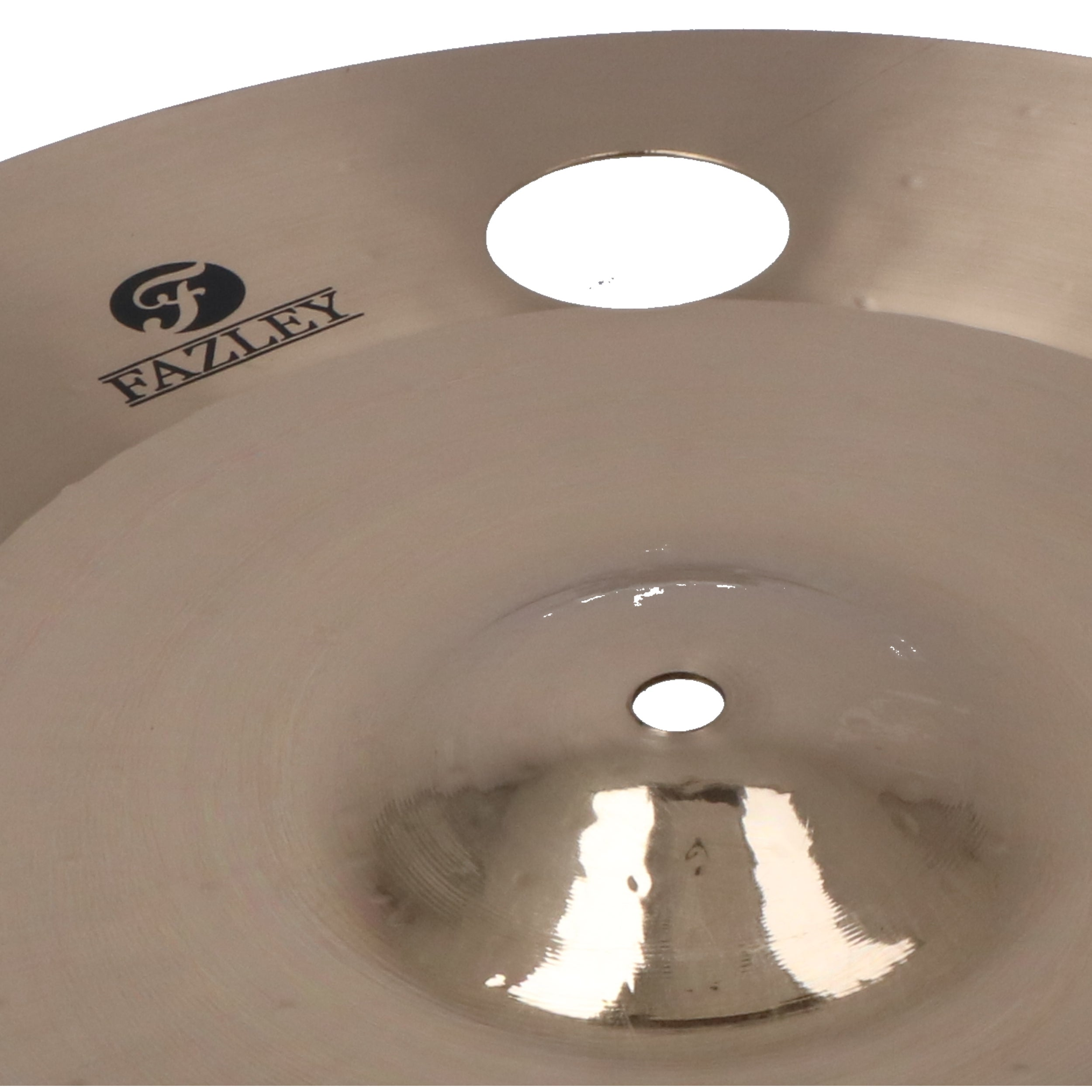 Close up of a light brown cymbal with the Fazley logo and two holes.