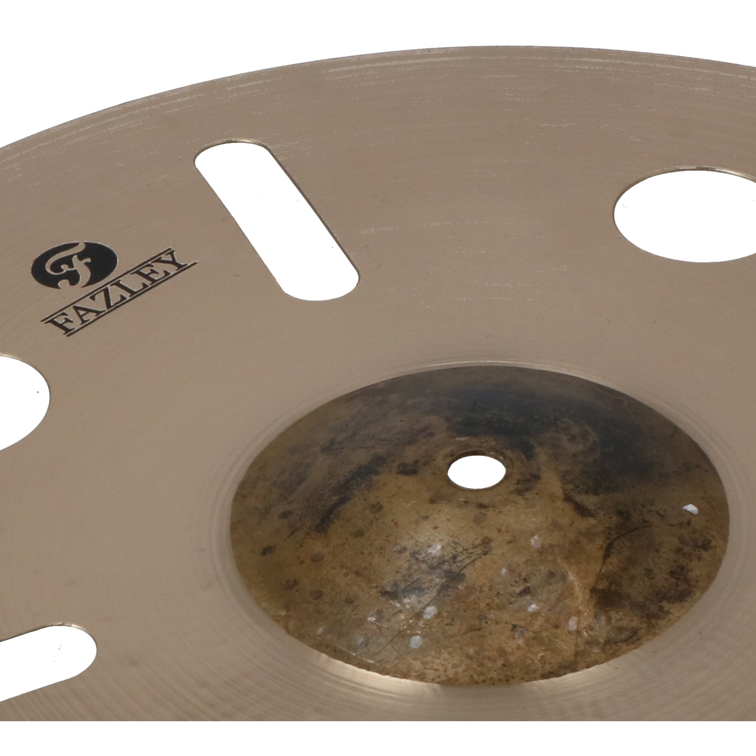 A golden cymbal edge with the Fazley logo and cutouts.