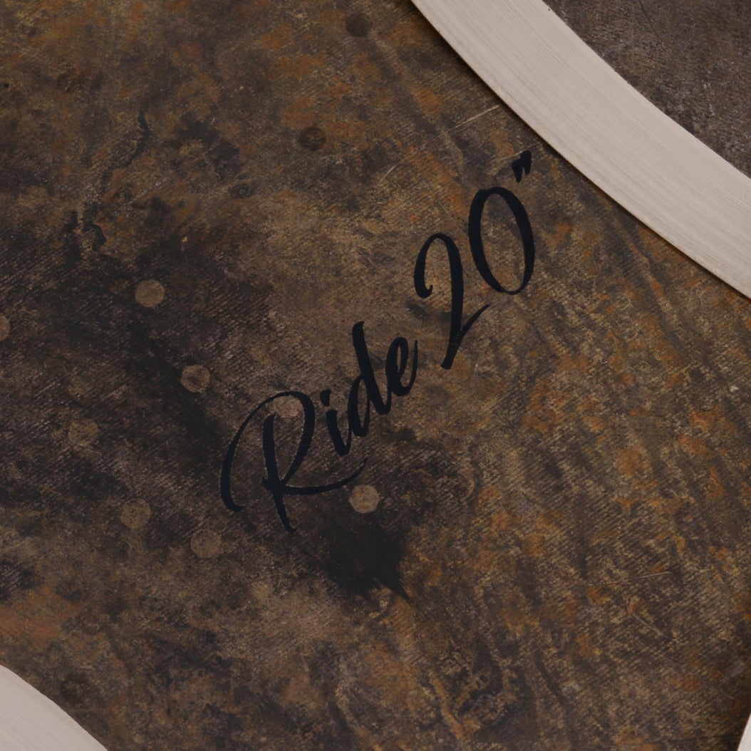 Dark cymbal surface with "Ride 20" written in script font.