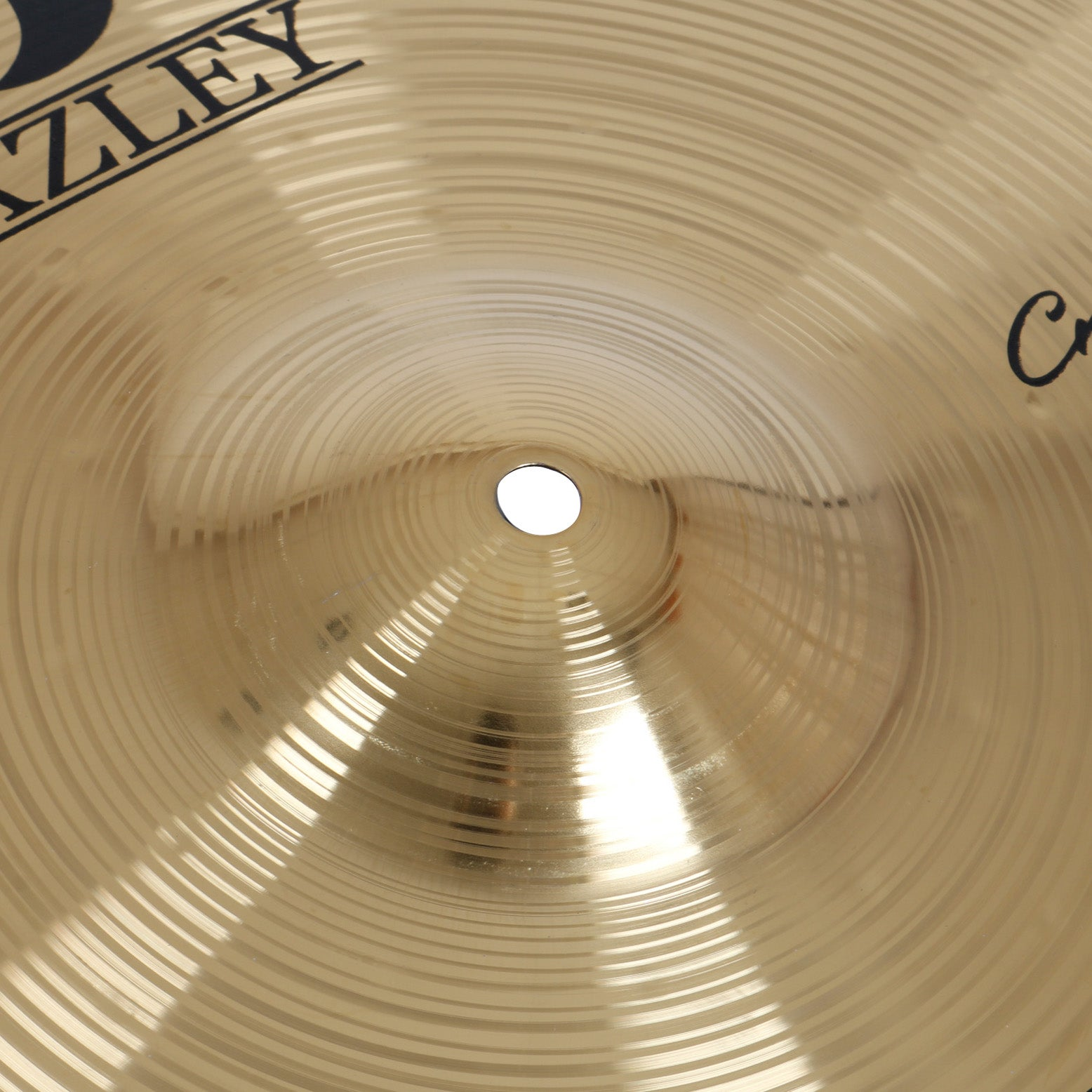 Brass cymbal with concentric grooves and a central hole. "ZLEY" brand visible.
