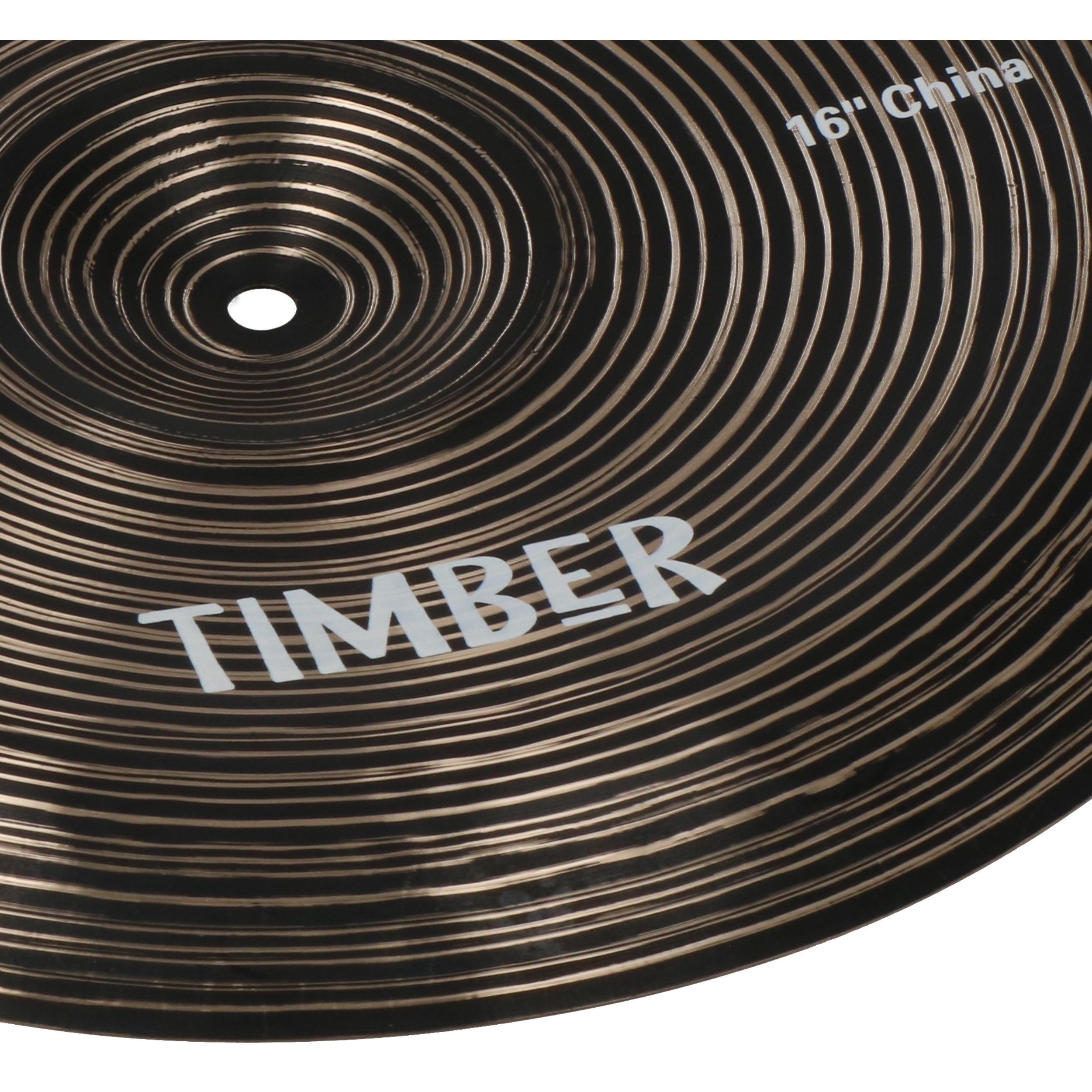 Dark cymbal with concentric grooves and white lettering 'TIMBER'.