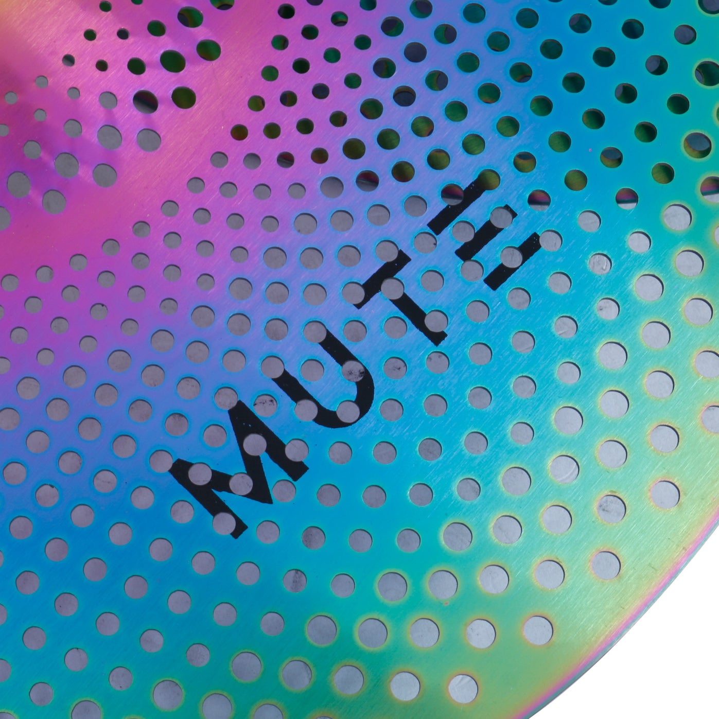 A colorful perforated metal sheet with the word MUTE in black.