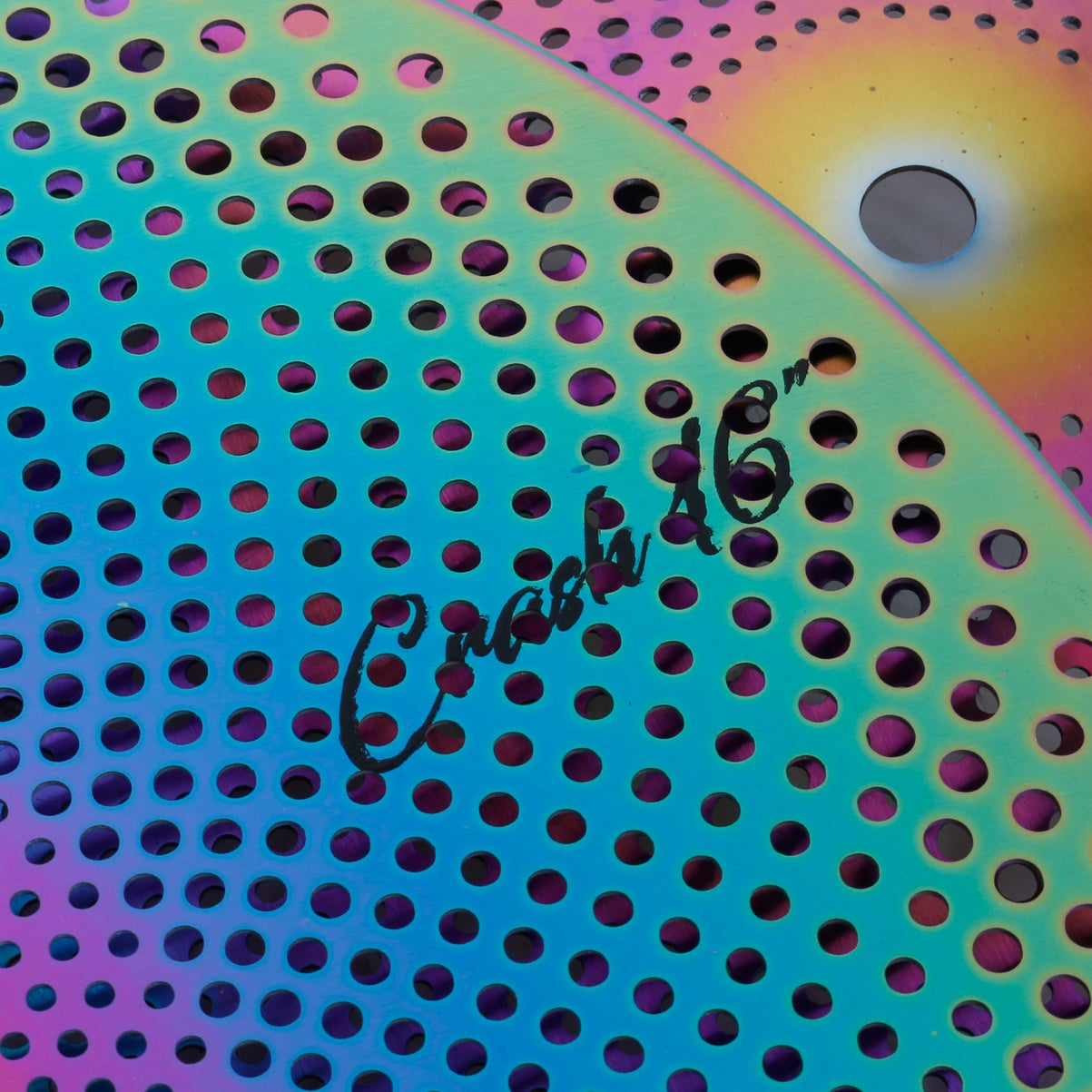 Close-up of a colorful perforated metal sheet with 