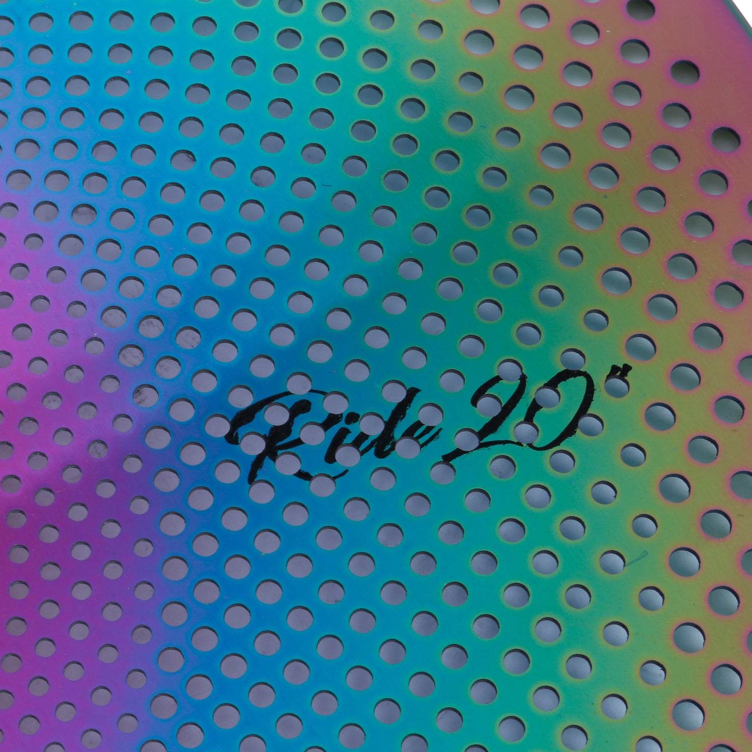 A cymbal with rainbow metallic finish and perforations, text reads 'Ride 20"'.