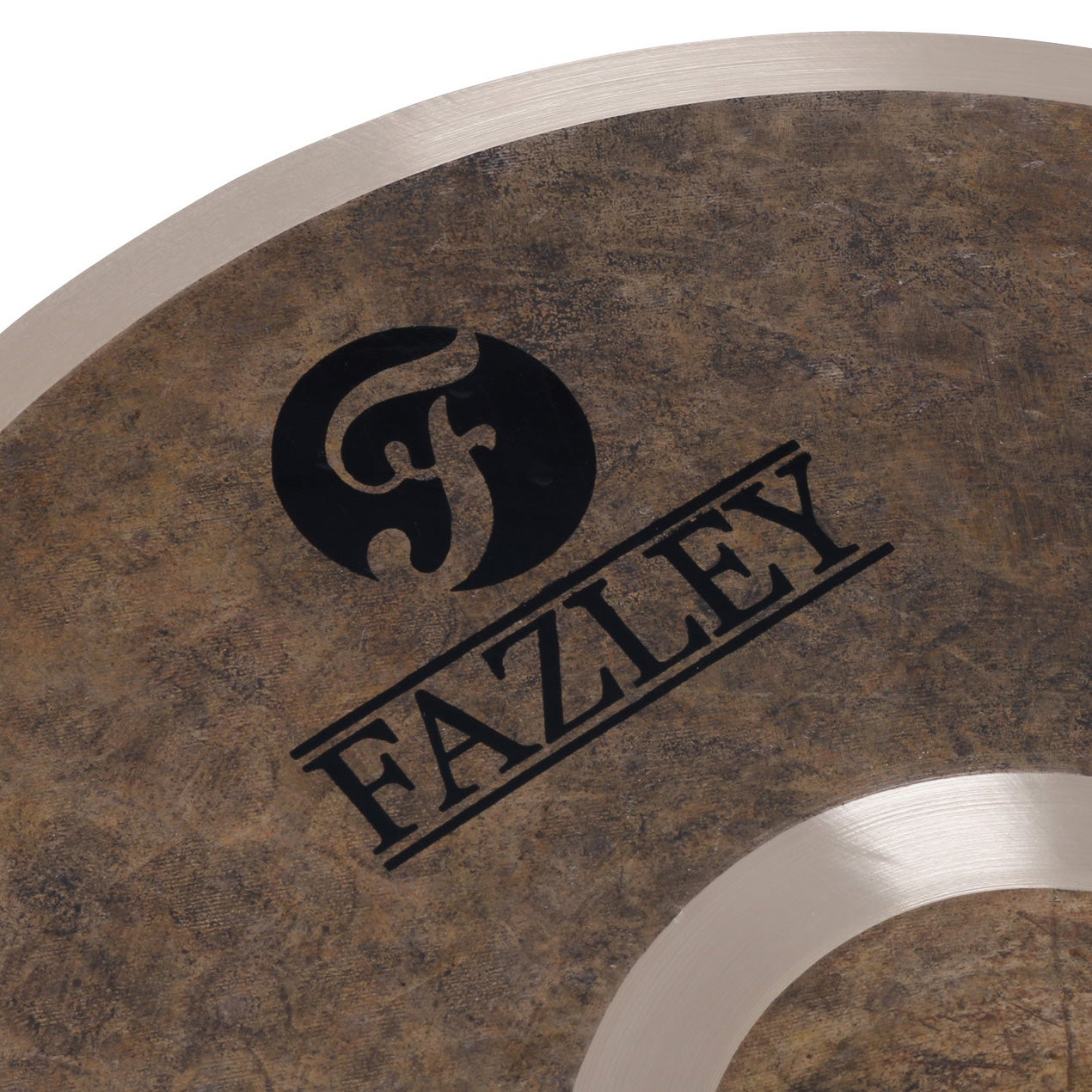 Close up of a brown disc with a black Fazley logo and a metal ring.