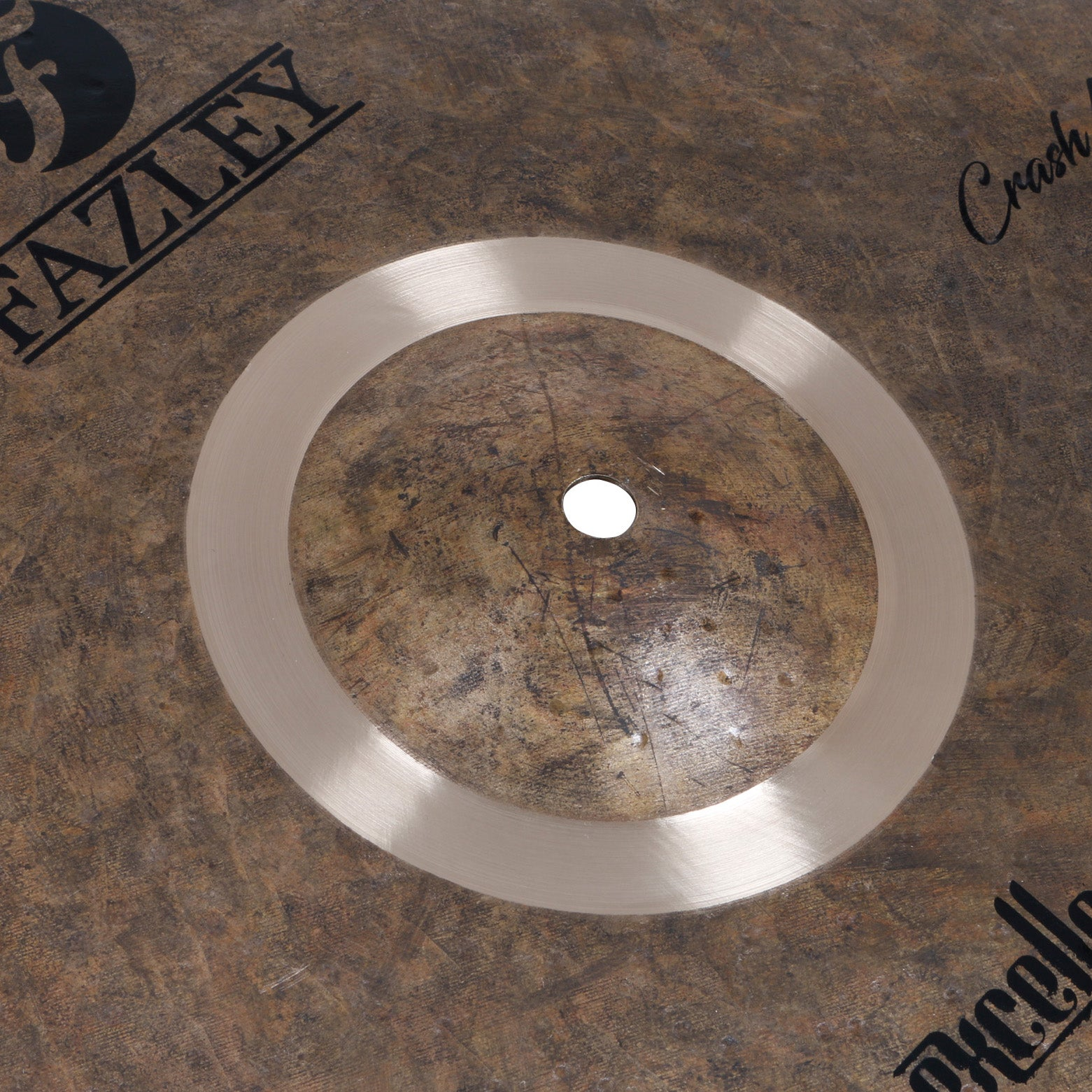 A cymbal with FAZLEY and Crash lettering.