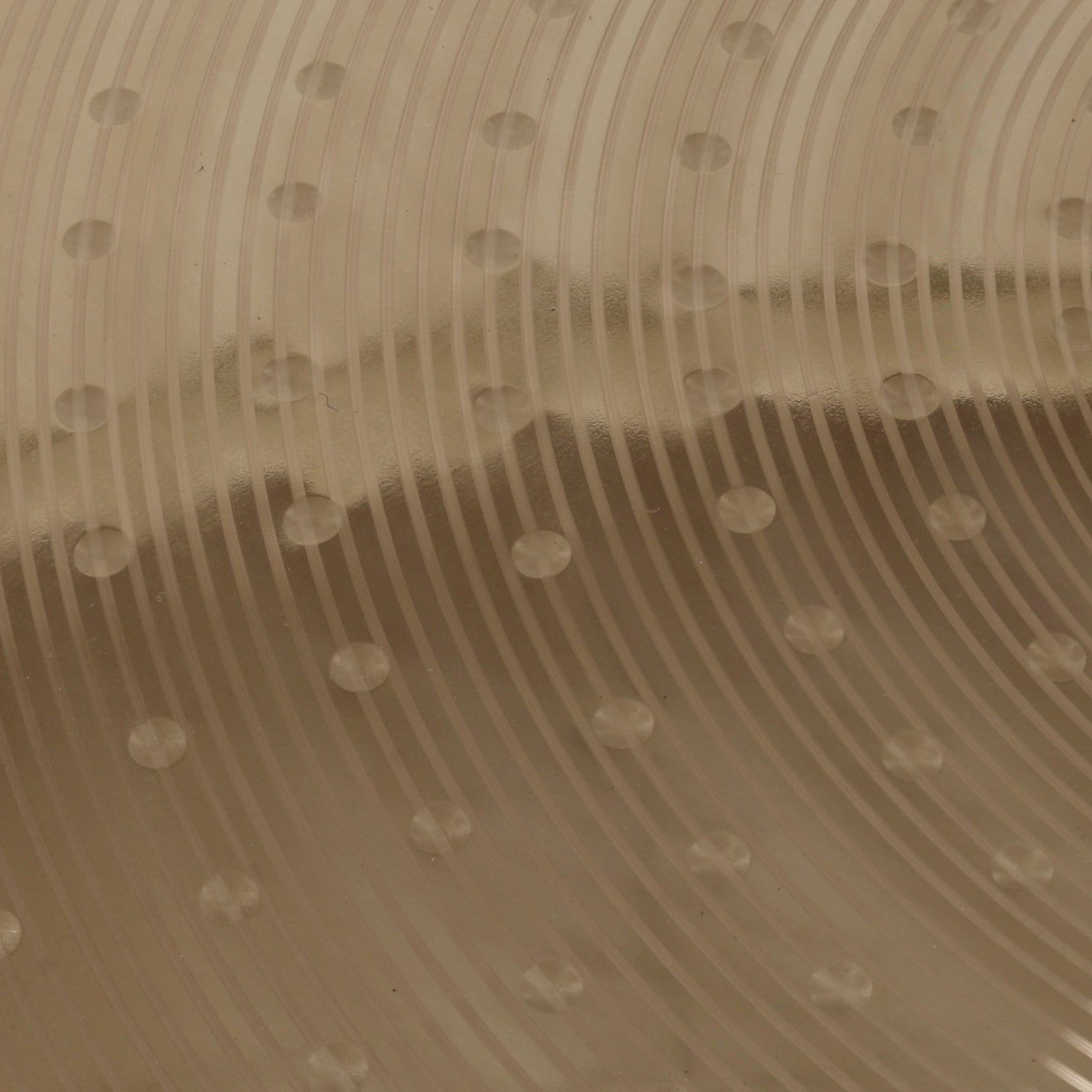 Transparent surface with parallel lines and circles.