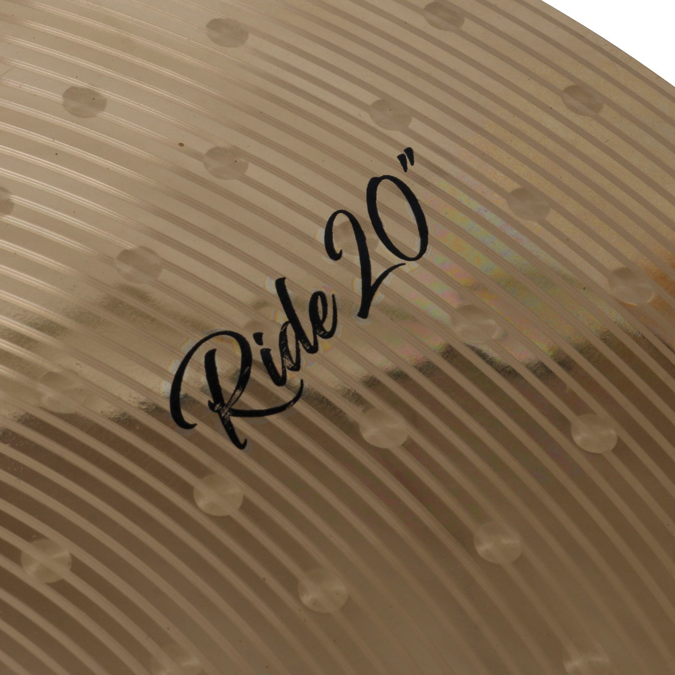 A golden cymbal surface with a ribbed pattern and the text 'Ride 20"'.