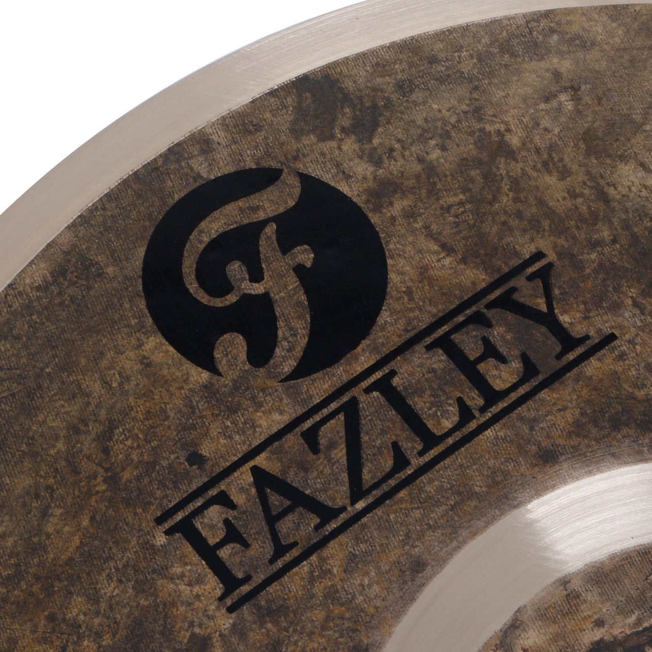 Close-up of a round object with a black circle and FAZLEY text.