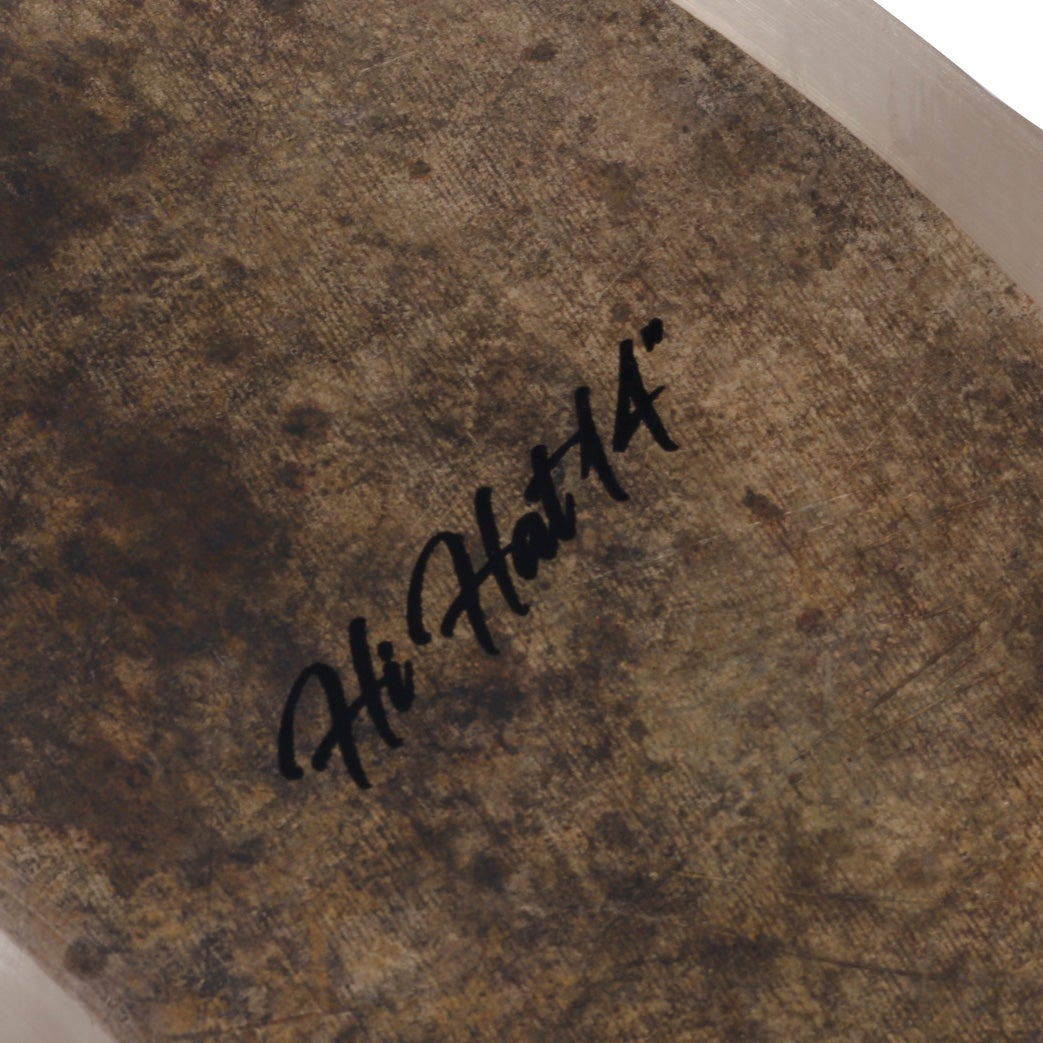 A brown, textured surface displays the signature "Hi Hat 14" in black script.