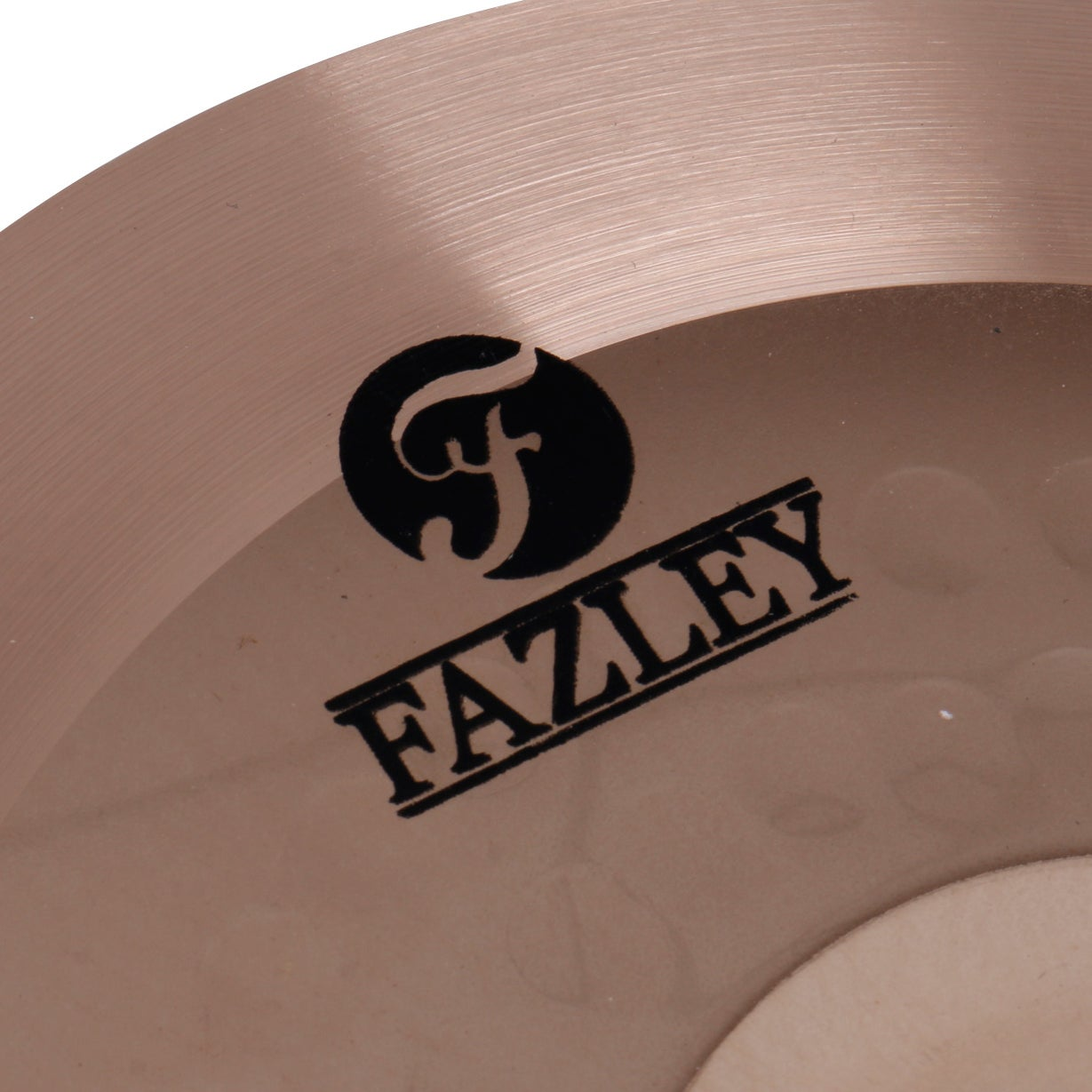Close up of a bronze cymbal with the Fazley logo and a stylized 'f'.