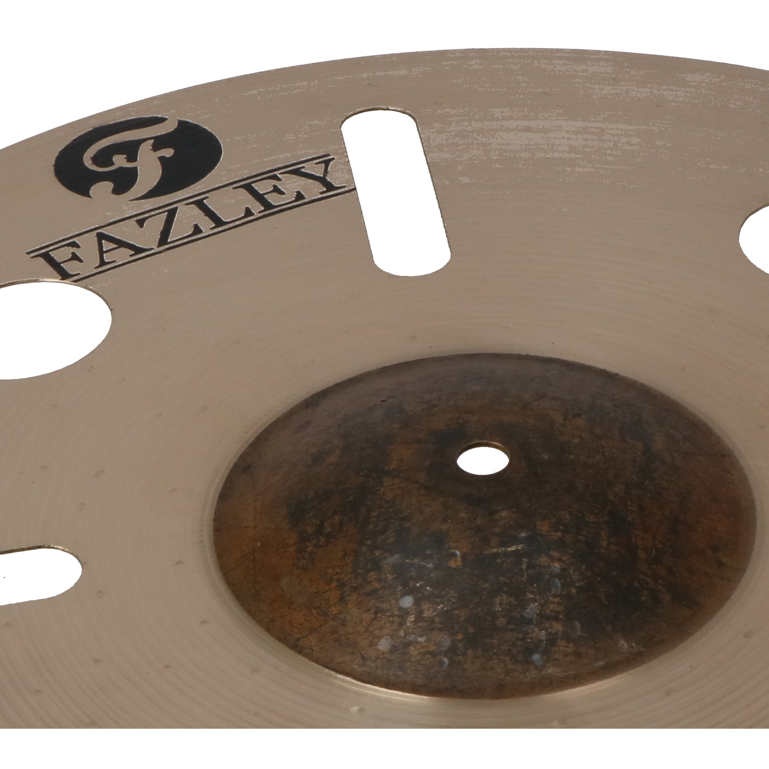 A golden cymbal with the Fazley logo and oval cutouts.