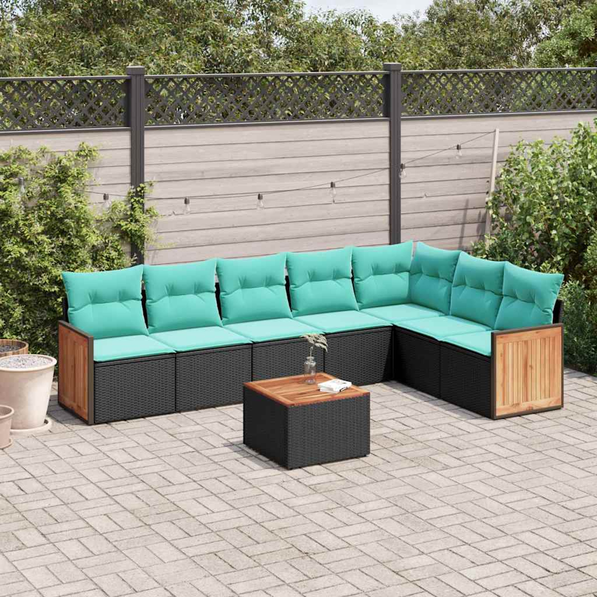 Ecklounge-Set mit tealfarbenen Kissen und einem Tisch auf einer Steinterrasse.