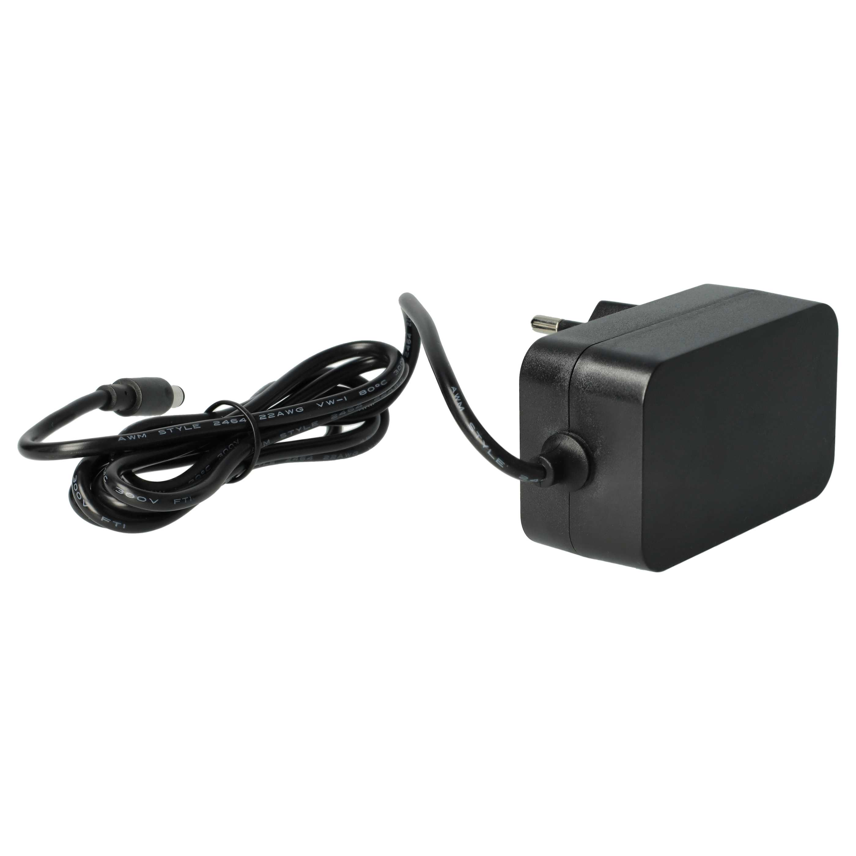 Ein schwarzes Netzteil mit einem gewickelten Kabel und einem runden Stecker.