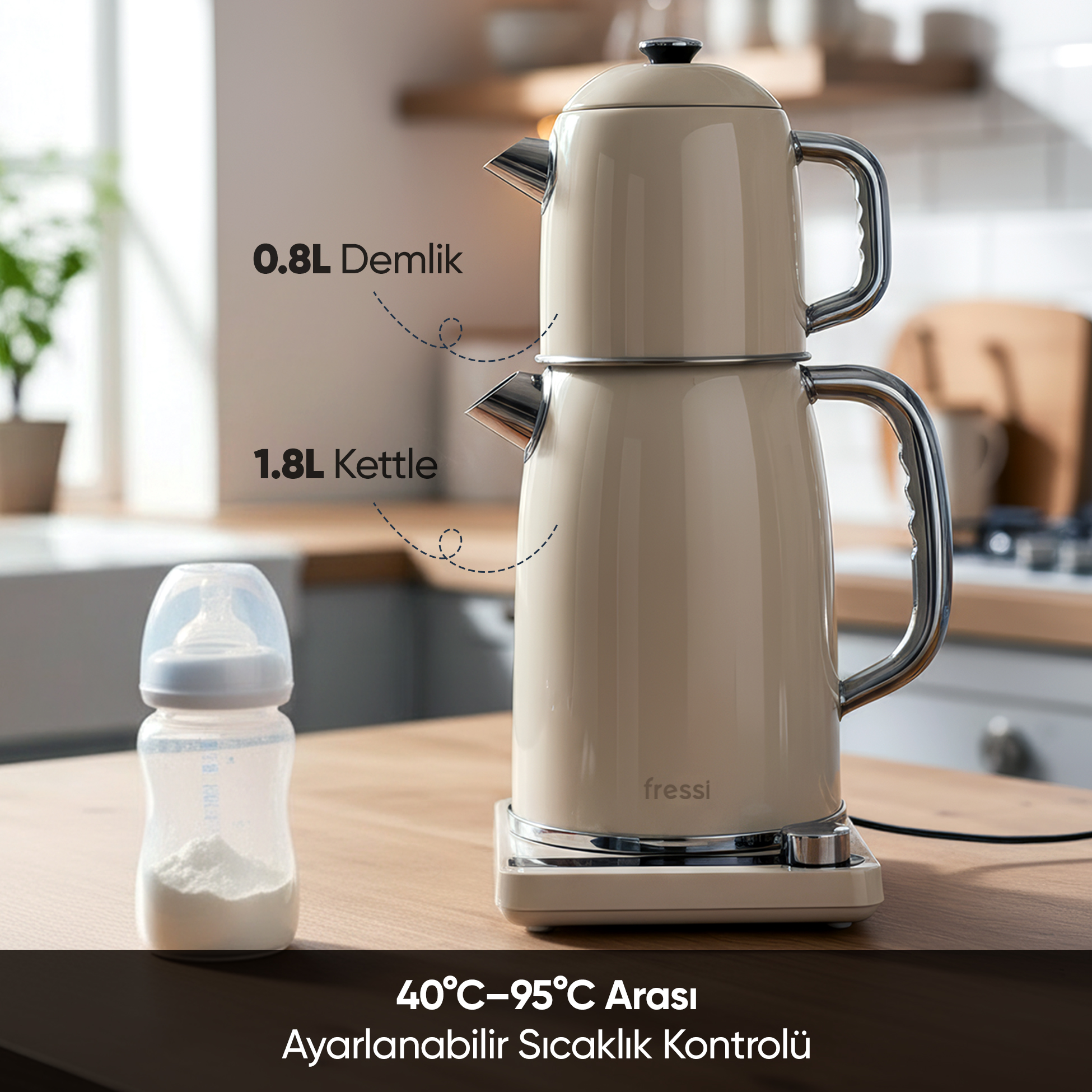 0,8L demlikli, 1,8L su ısıtıcılı bej çay makinesi, yanında bebek maması şişesi.