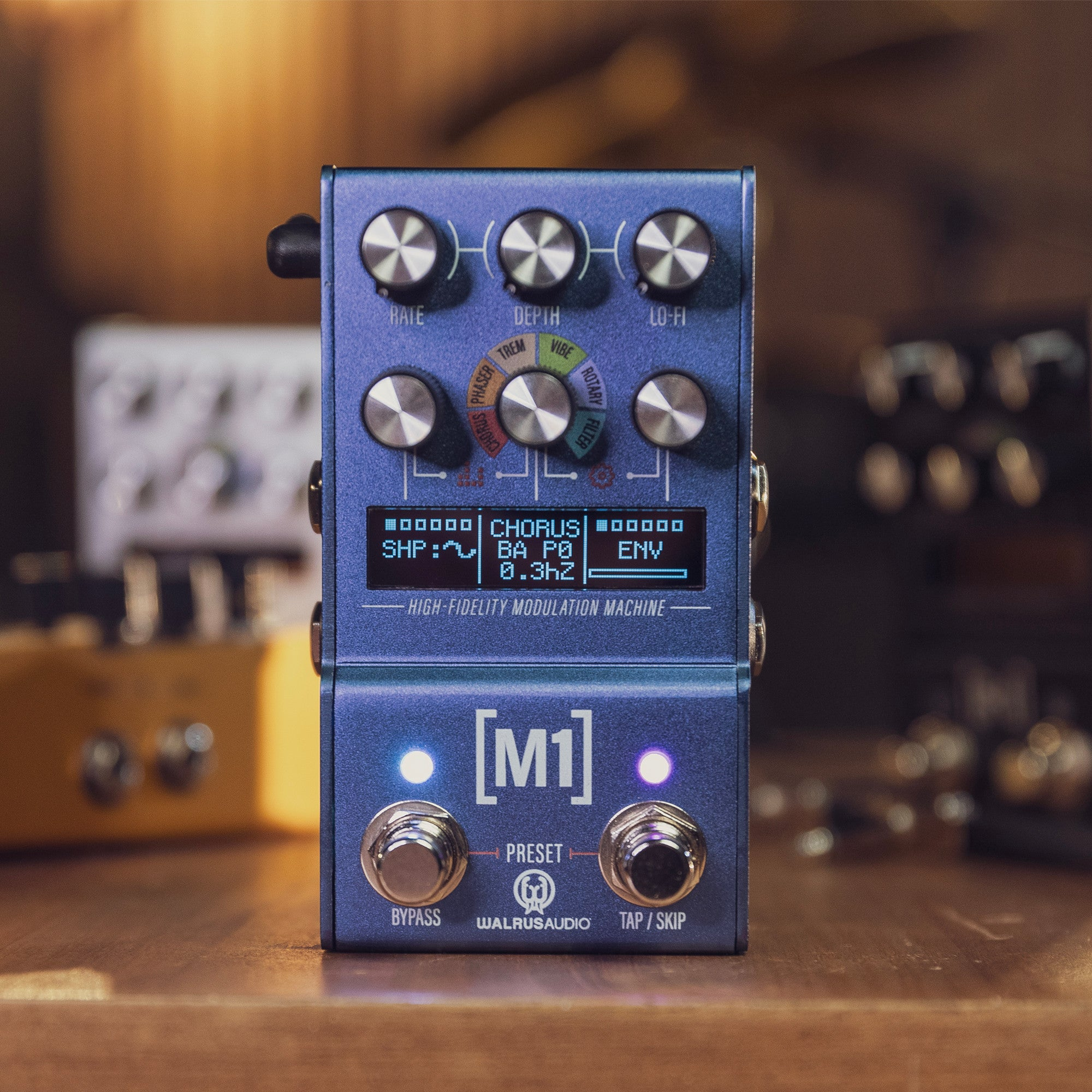 A blue Walrus Audio M1 modulation pedal with knobs and a display screen.